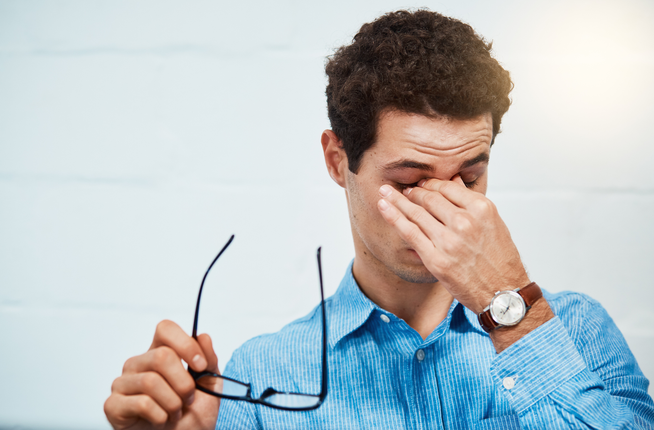 Eyestrain or overwork? Man has eye trouble.