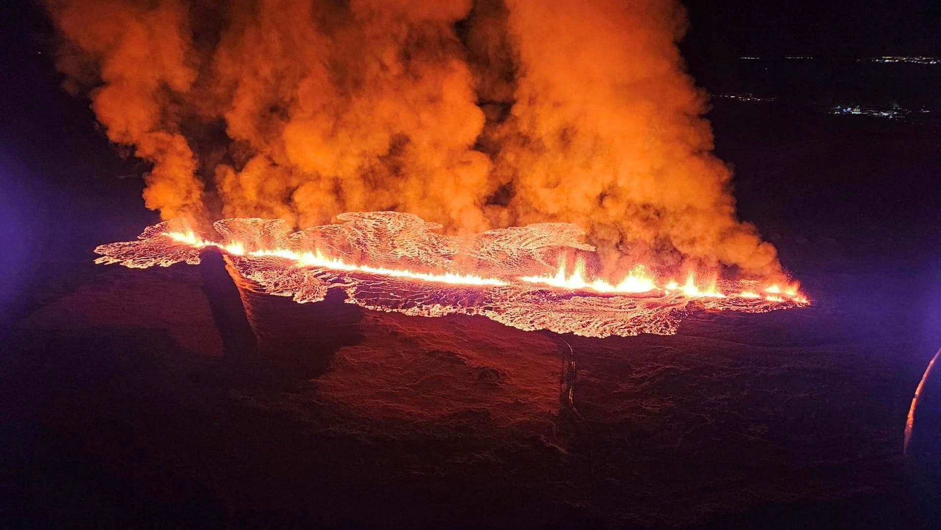 A volcano spews lava and smoke as it erupts in Reykjanes Peninsula, Iceland, January 14, 2024. Iceland Civil Protection