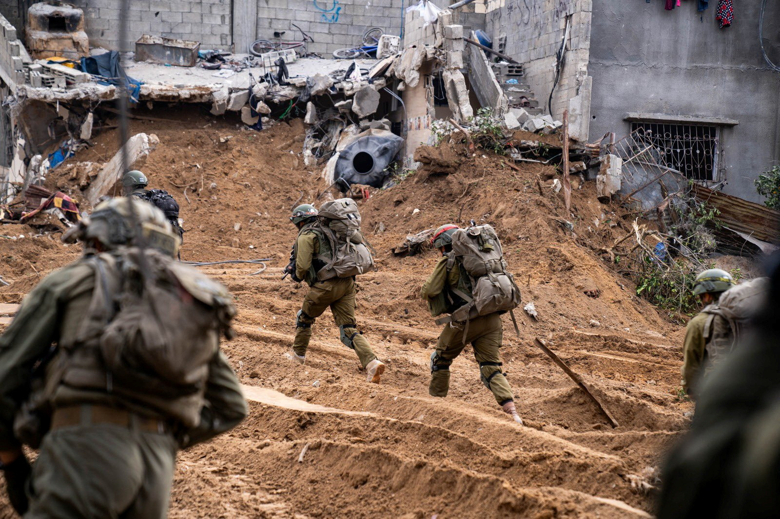 Israeli soldiers operate in the Gaza Strip amid the ongoing conflict between Israel and the Palestinian Islamist group Hamas, in this handout picture released on December 31, 2023. Israel Defense Forces