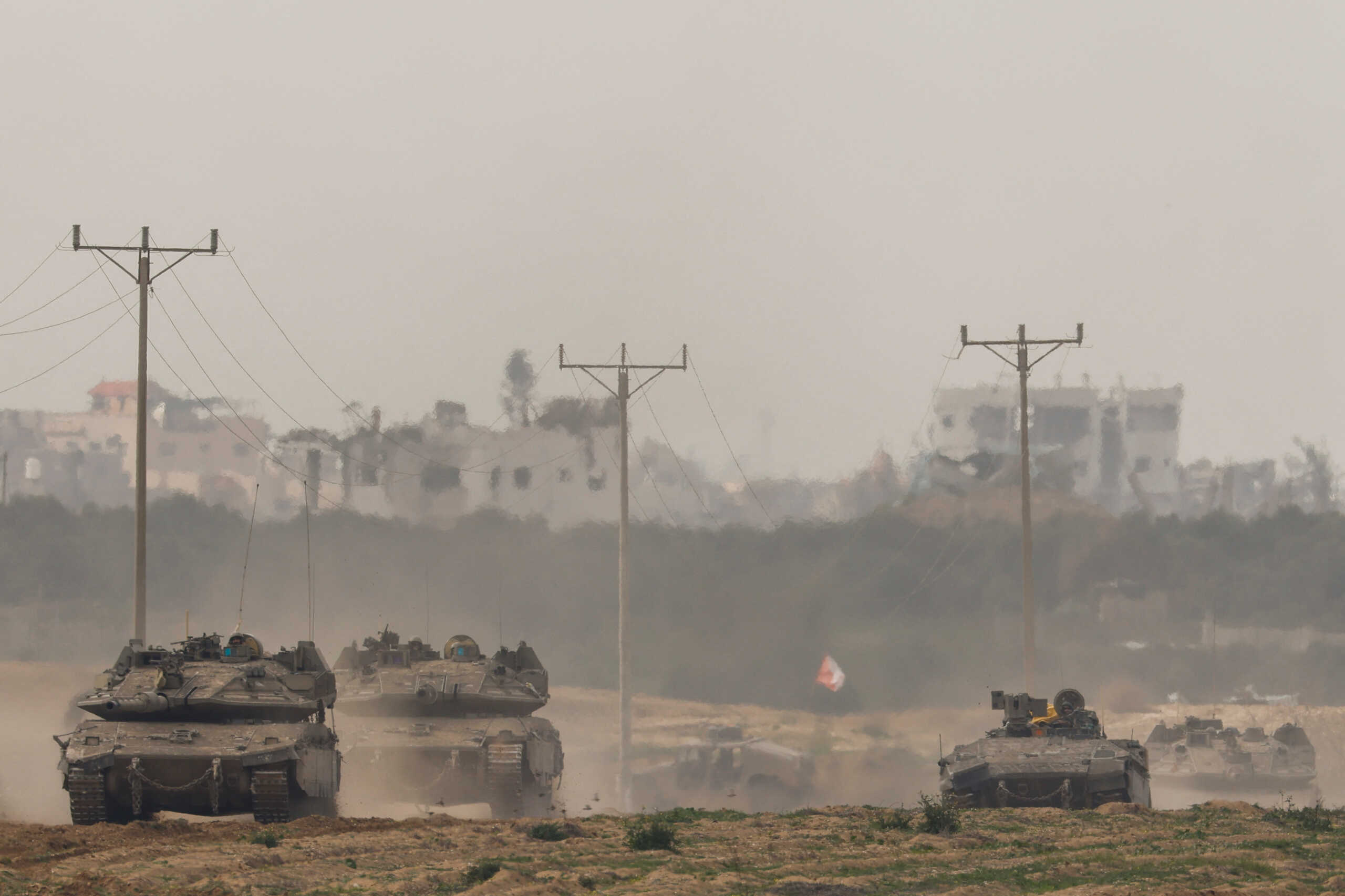 Israeli tanks re-enter Israel from Gaza, amid the ongoing conflict between Israel and the Palestinian Islamist group Hamas, near the Israel-Gaza border, in southern Israel, January 11, 2024. REUTERS