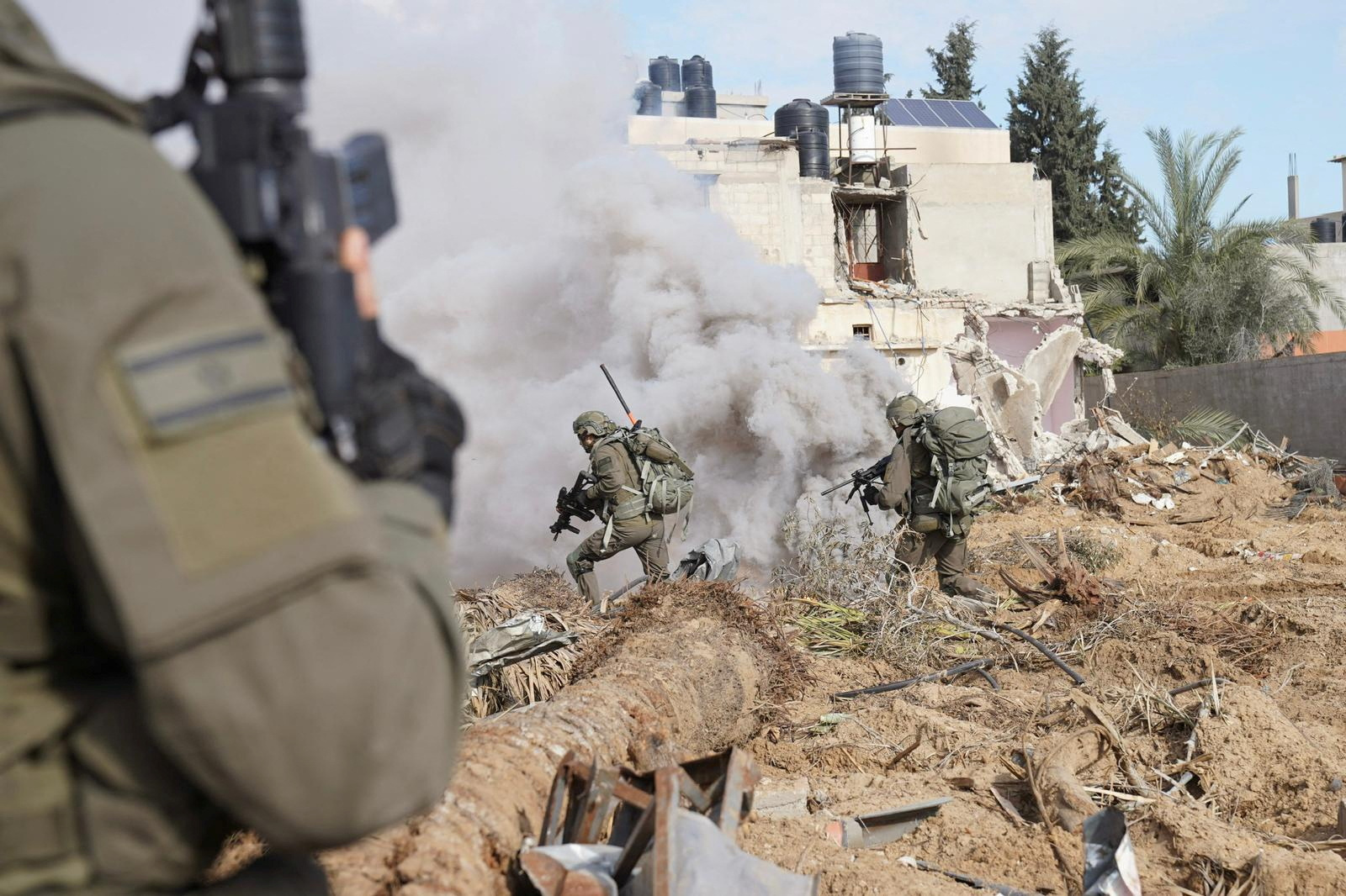 Israeli soldiers operate in the Gaza Strip amid the ongoing conflict between Israel and the Palestinian Islamist group Hamas, in this handout picture released on January 6, 2024. Israel Defense Forces