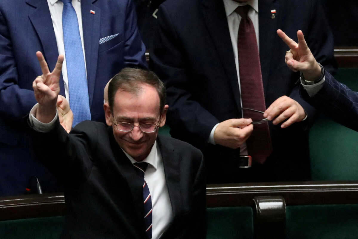 Former Polish Interior Minister Mariusz Kaminski from Law and Justice gestures during a parliamentary session at the parliament in Warsaw, Poland, December 21, 2023. Slawomir Kaminski