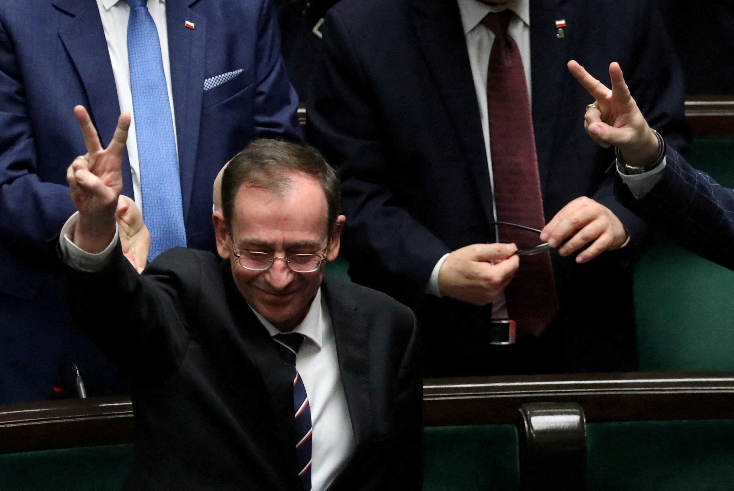 Former Polish Interior Minister Mariusz Kaminski from Law and Justice gestures during a parliamentary session at the parliament in Warsaw, Poland, December 21, 2023. Slawomir Kaminski