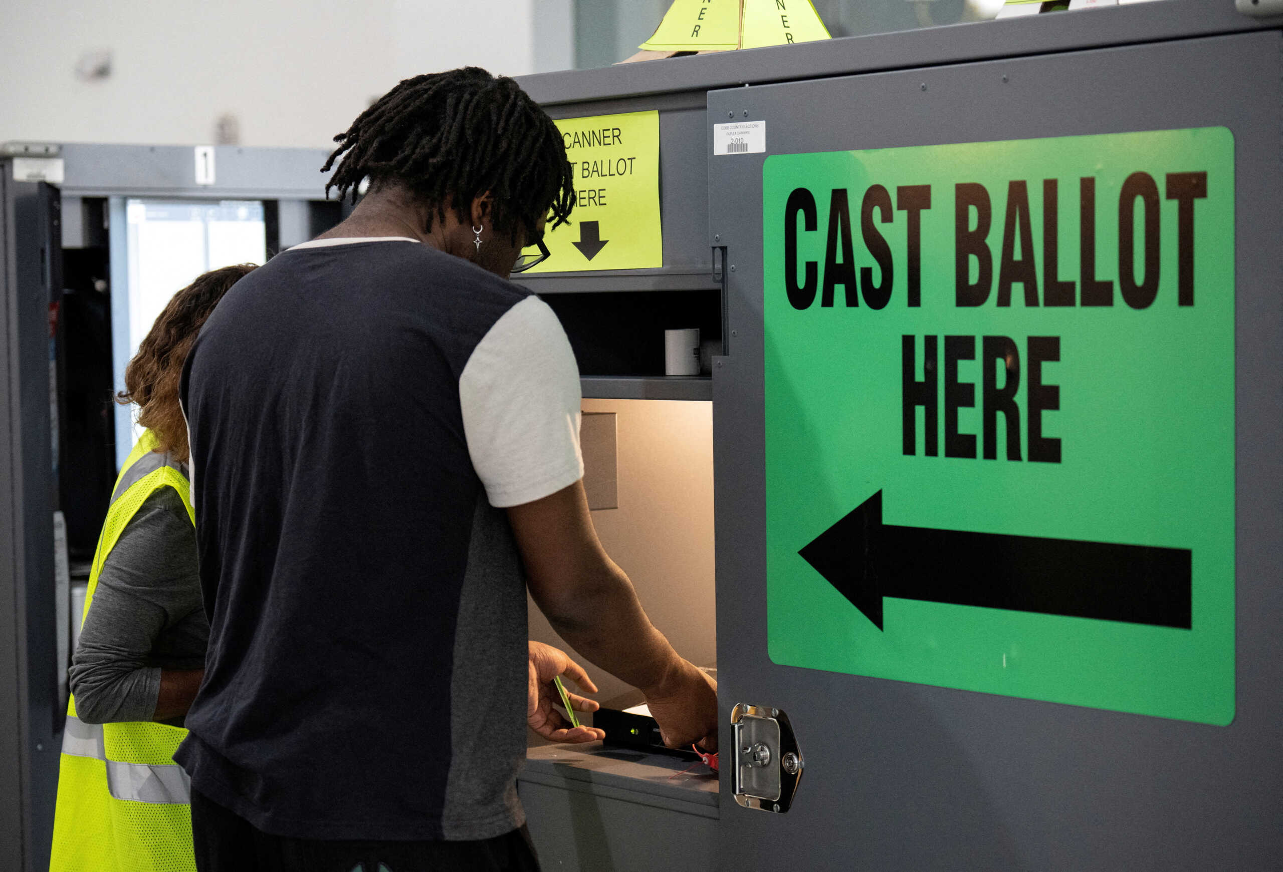 FILE PHOTO: A voter casts his ballot for midterm elections at a polling station in Marietta, Georgia, U.S., November 8, 2022.   REUTERS