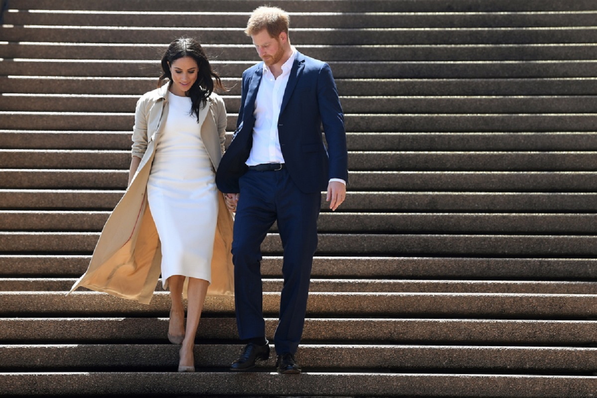 epa09055934 (FILE) - Britain's Prince Harry (R), the Duke of Sussex, and his wife Meghan (L), the Duchess of Sussex, arrive for a 'meet the people walk' at the Sydney Opera House in Sydney, Australia, 16 October 2018 (reissued 06 March 2021). US channel CBS will air an interview with Britain's Harry and Meghan, Duke and Duchess of Sussex on Sunday, 07 March.  EPA