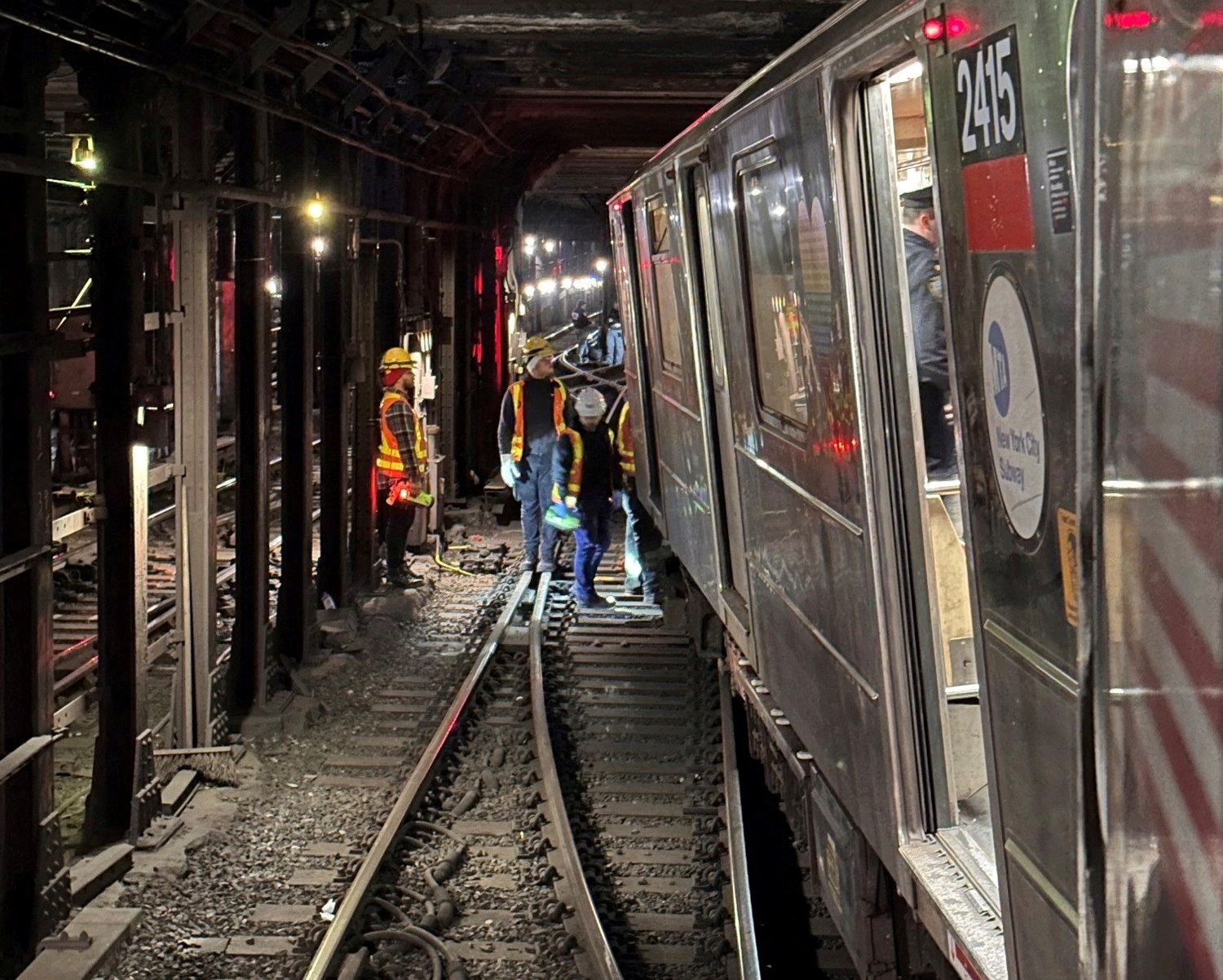 Crew members assess derailed train in New York, U.S.,  January 4, 2024 in this handout image. NYC EMERGENCY MANAGEMENT