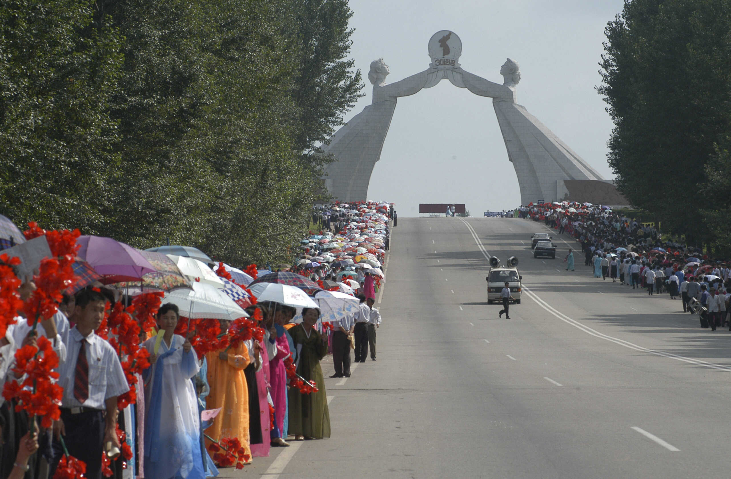 FILE PHOTO: People take part in the celebrations for the National Liberation Day near the Arch of Reunification in the city of Pyongyang, North Korea August 14, 2005. North Korea has demolished the Arch after leader Kim Jong Un said in January 2024 that reunification was no longer possible. Picture taken August 14, 2005.
