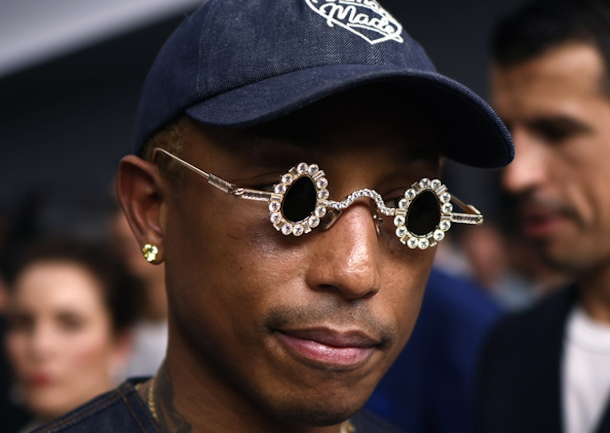 epa10708194 US singer and designer Pharrell Williams leaves after attending the presentation from the Spring