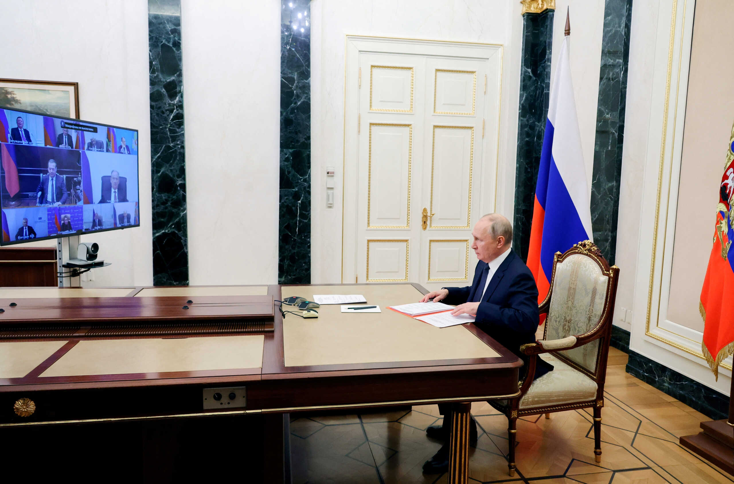 Russian President Vladimir Putin chairs a meeting with members of the Security Council via video link at the Kremlin in Moscow, Russia, December 22, 2023. Sputnik