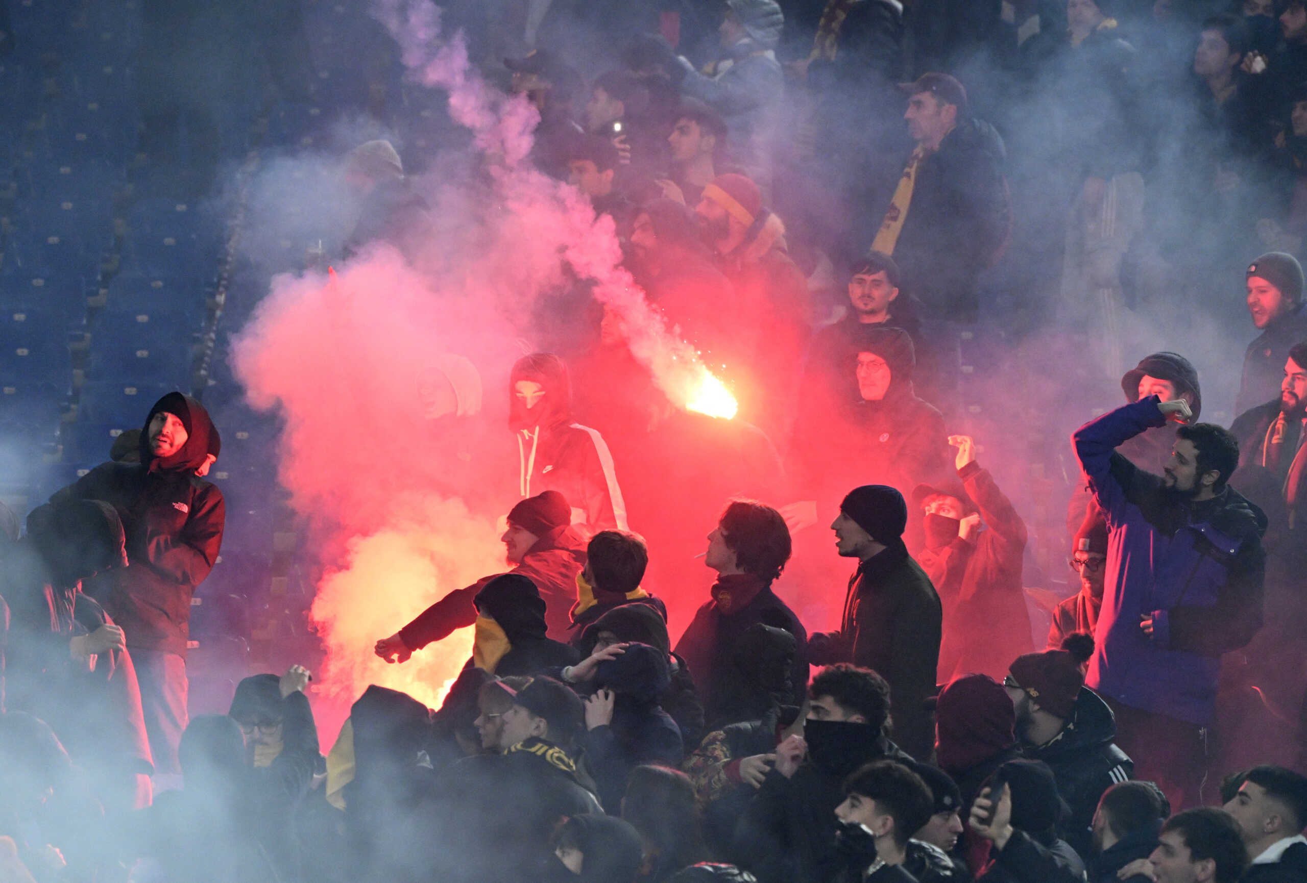 Soccer Football - Coppa Italia - Quarter Final - Lazio v AS Roma - Stadio Olimpico, Rome, Italy - January 10, 2024 Fans throw flares in the stands before the match REUTERS