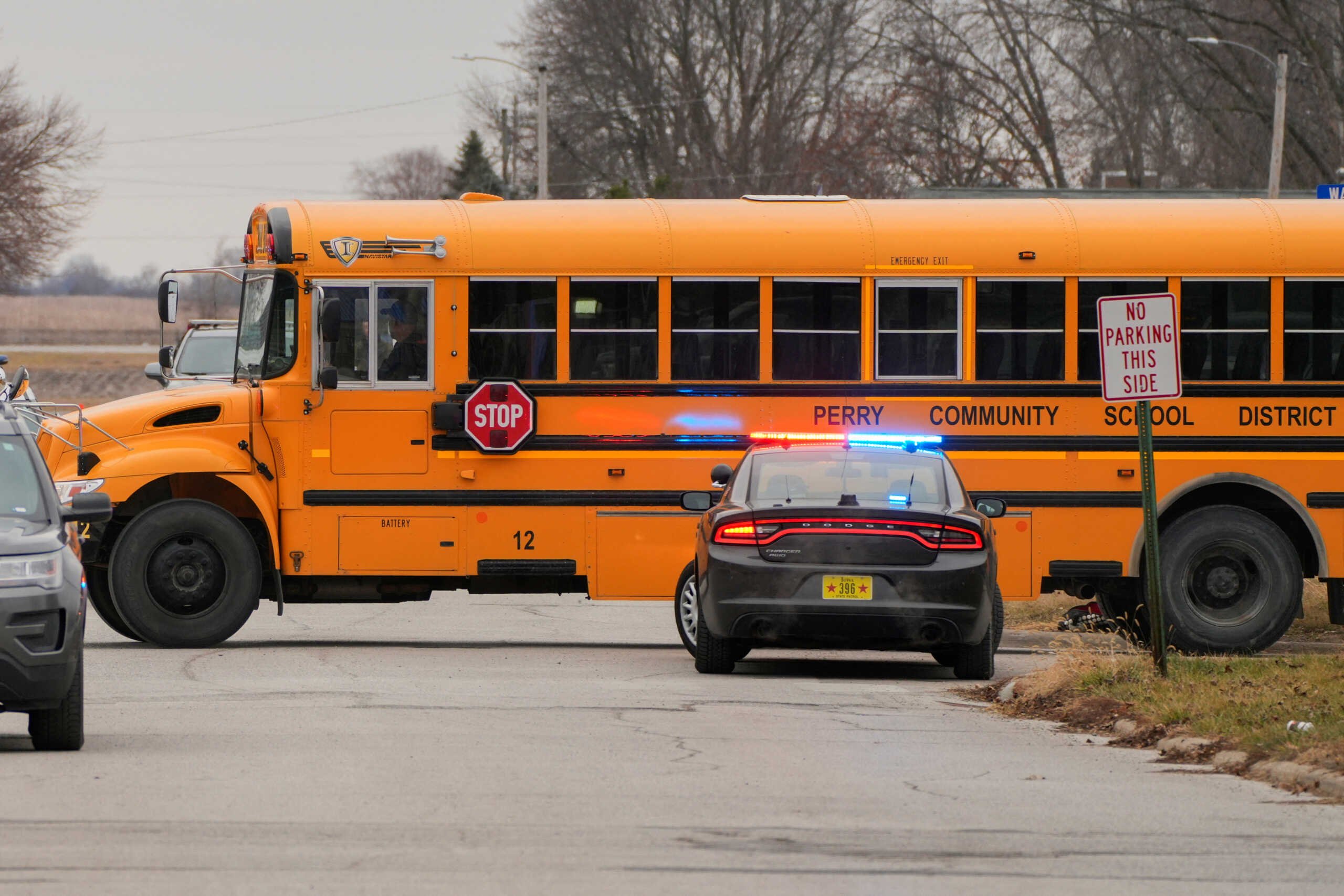 A Perry school bus passes by as police respond to a school shooting at the Perry Middle School and High School in Perry, Iowa, U.S., January 4, 2024.  REUTERS