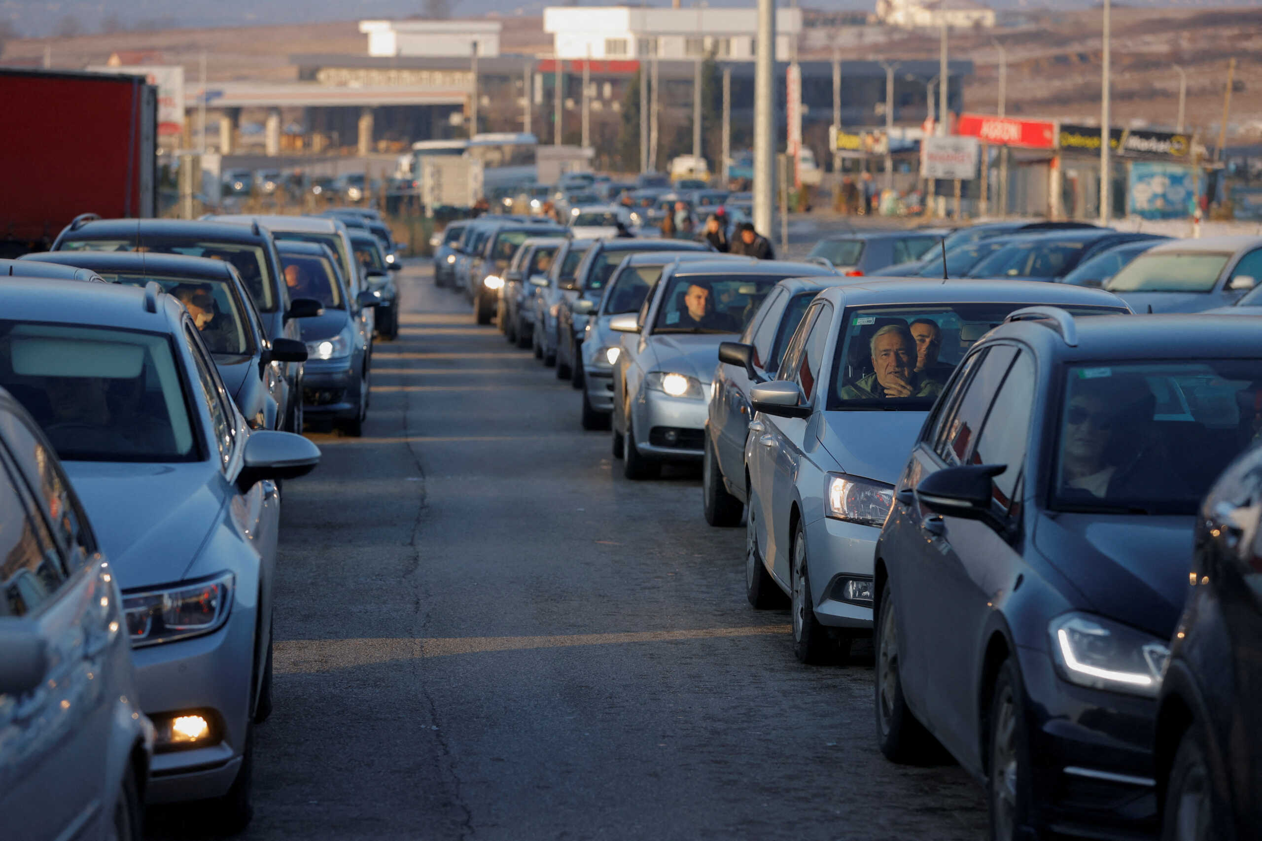 Kosovo ethnic Serbs queue at the Kosovo-Serbia border crossing in Merdare, Kosovo December 17, 2023, on their way to vote in Serbia. Kosovo ethnic Serbs traveled by buses and cars from different parts of Kosovo to cast their vote for the Serbia's parliamentary elections in Serbia. REUTERS