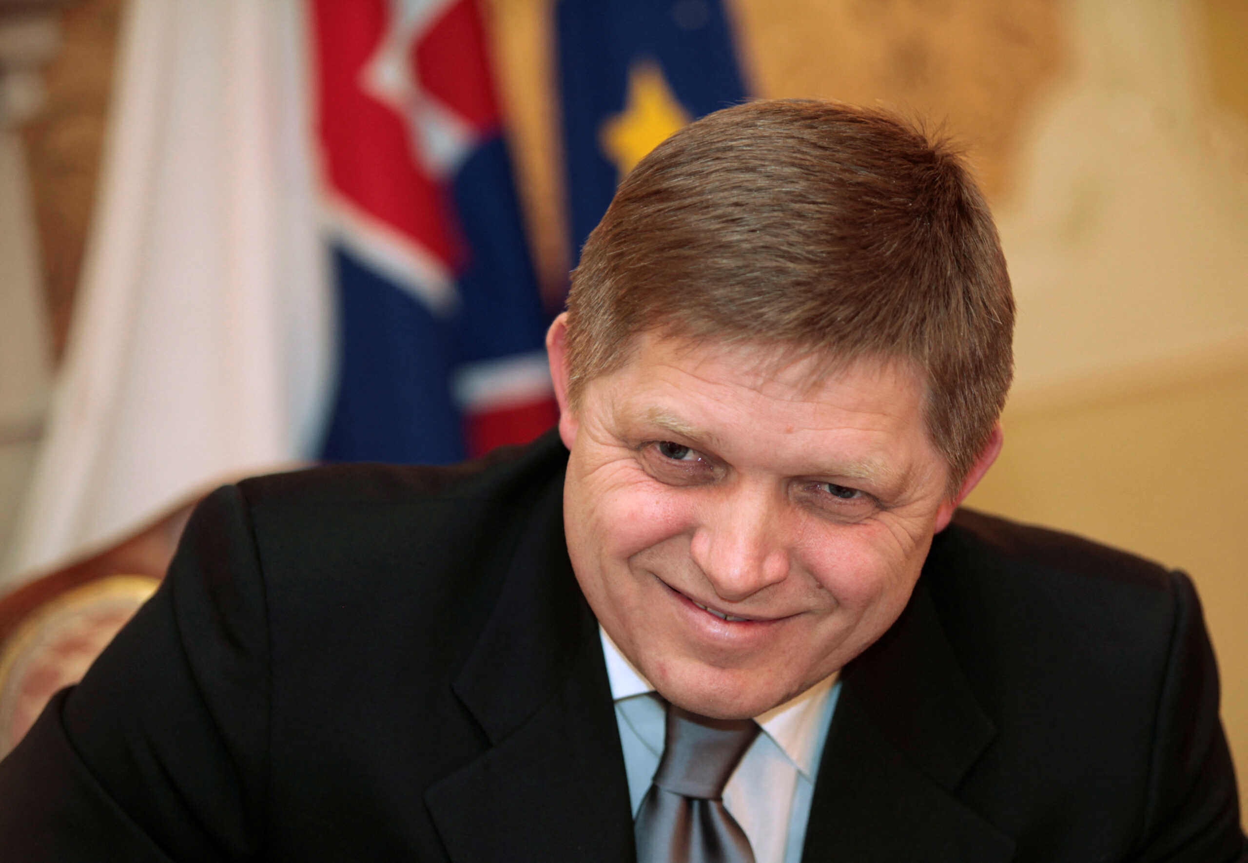 FILE PHOTO: Slovak Prime Minister Robert Fico smiles during an interview with Reuters ahead of Slovakia's June 2010 general election, in Bratislava February 19, 2010.   REUTERS