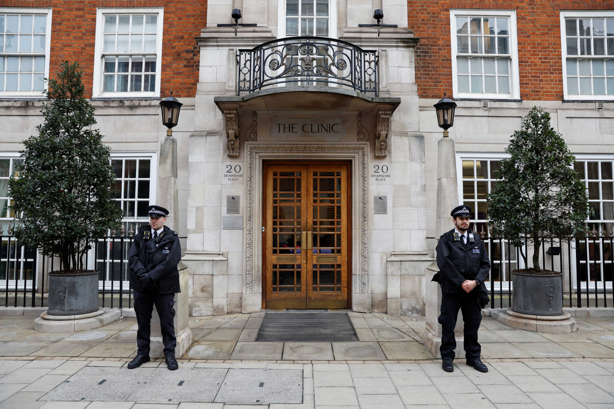 Police officers stand outside the London Clinic, where Britain's Catherine, Princess of Wales, is hospitalised for abdominal surgery, in London, Britain, January 17, 2024. REUTERS
