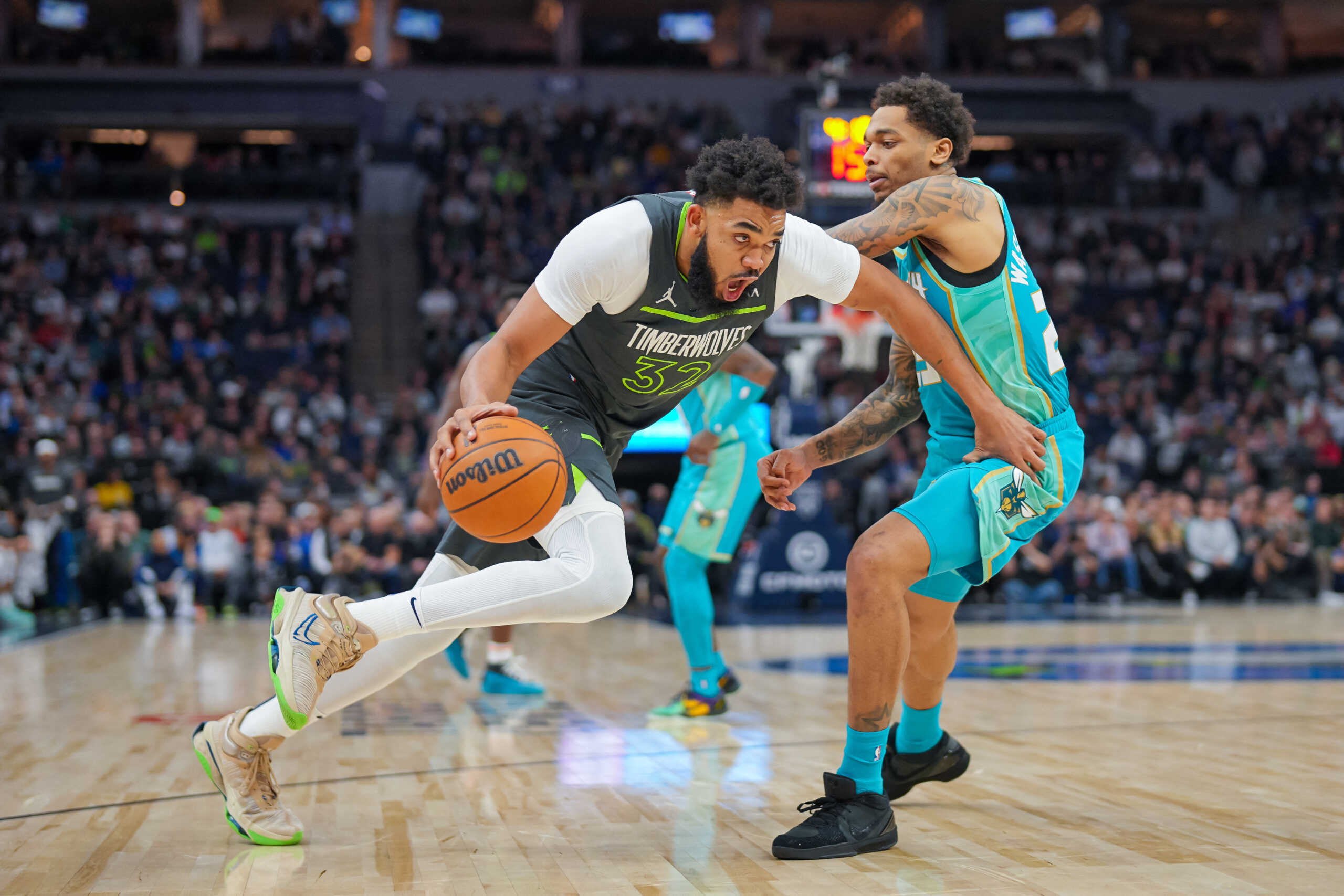Jan 22, 2024; Minneapolis, Minnesota, USA; Minnesota Timberwolves center Karl-Anthony Towns (32) dribbles against the Charlotte Hornets in the first half at Target Center. Mandatory Credit: Brad Rempel-USA TODAY Sports