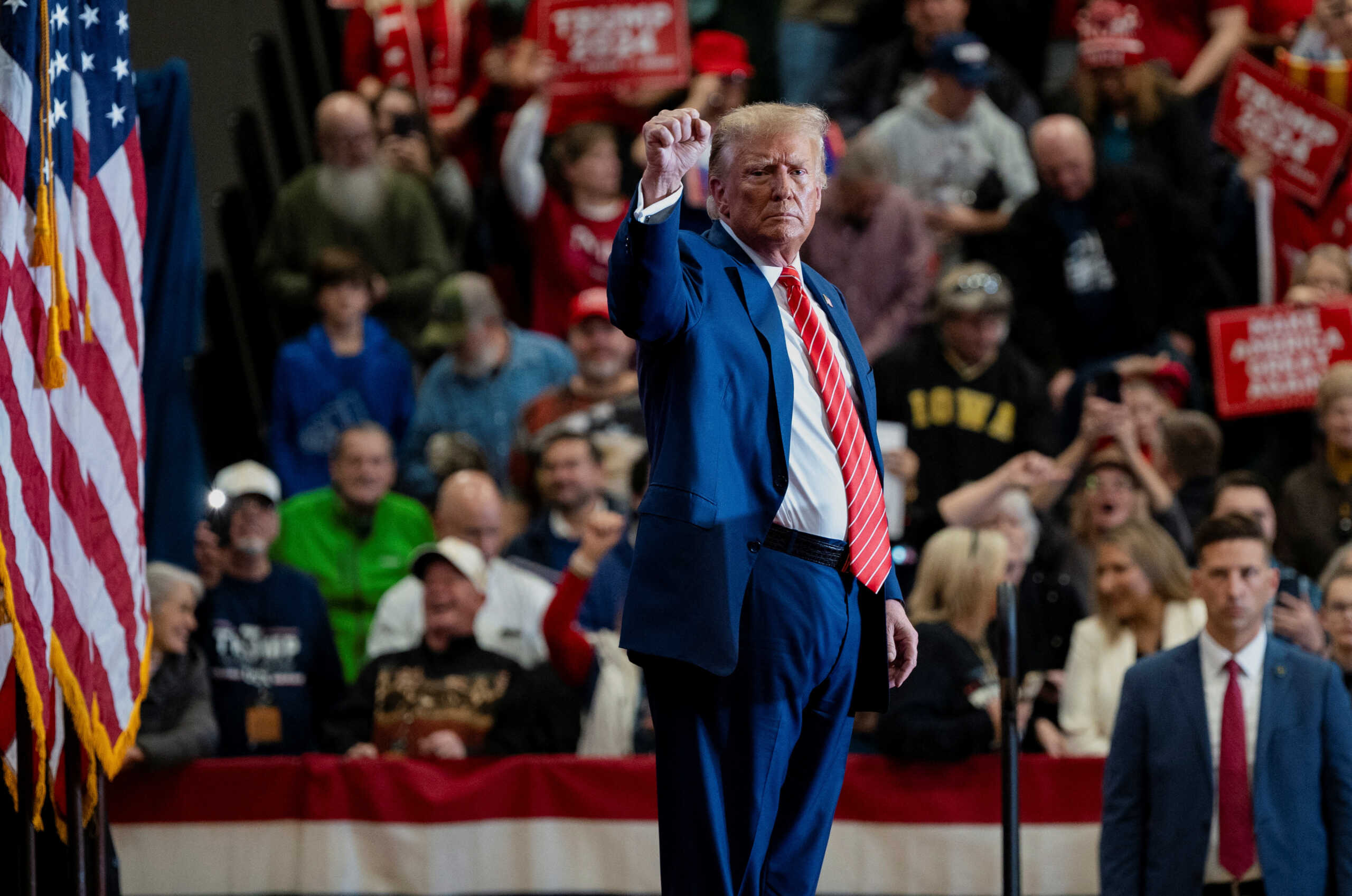 Former U.S. President and Republican presidential candidate Donald Trump gestures as he attends a campaign event, in Clinton, Iowa, U.S., January 6, 2024. REUTERS