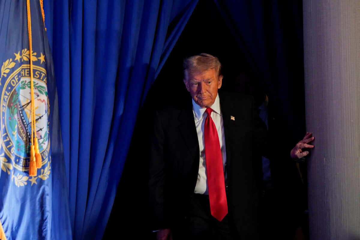 Former U.S. President and Republican presidential candidate Donald Trump walks on to the stage during a rally ahead of the New Hampshire primary election, in Portsmouth, New Hampshire, U.S., January 17, 2024. REUTERS