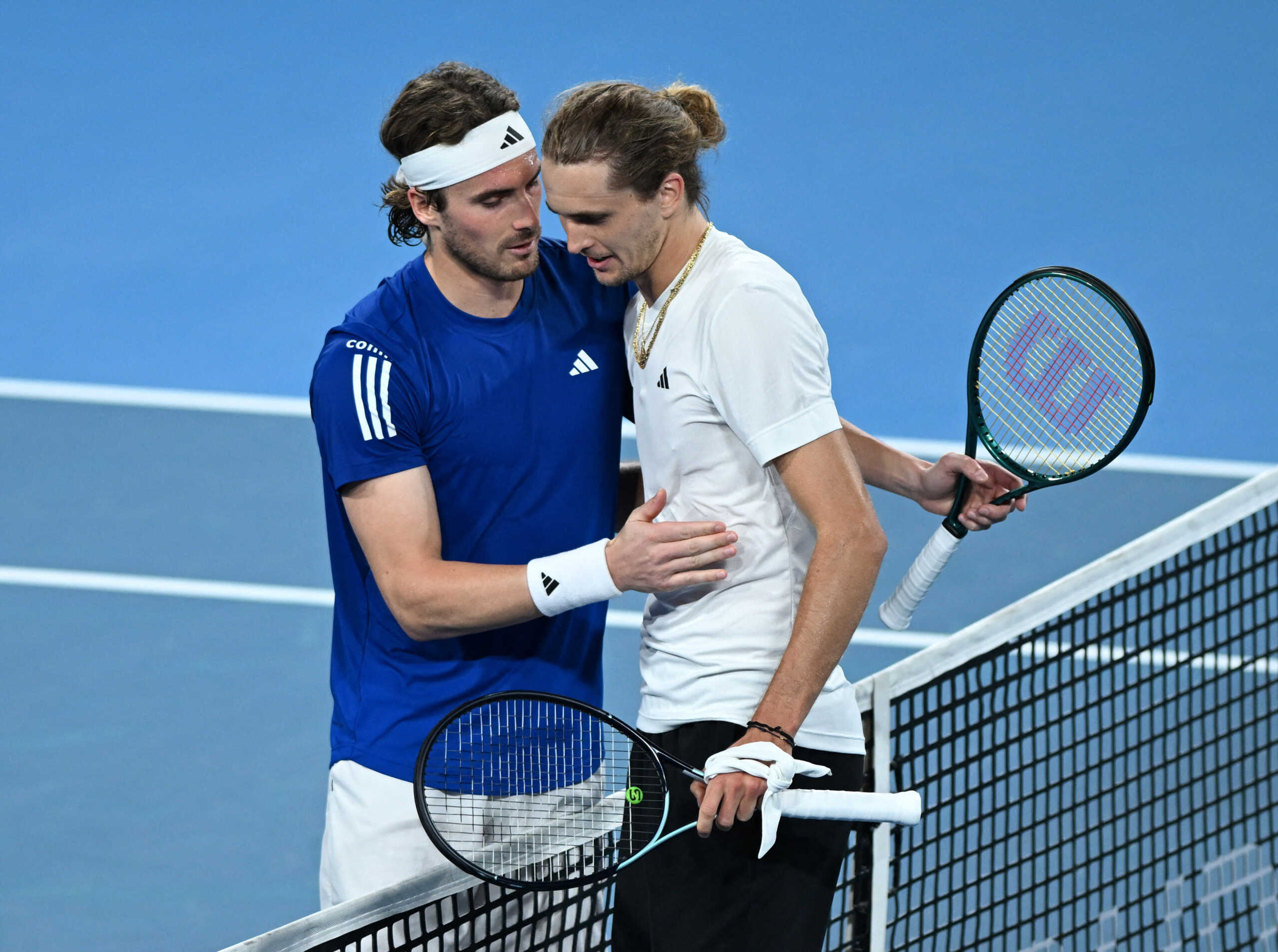 Tennis - United Cup - Ken Rosewall Arena, Sydney, Australia - January 5, 2024 Germany's Alexander Zverev with Greece's Stefanos Tsitsipas after winning their quarterfinal match REUTERS