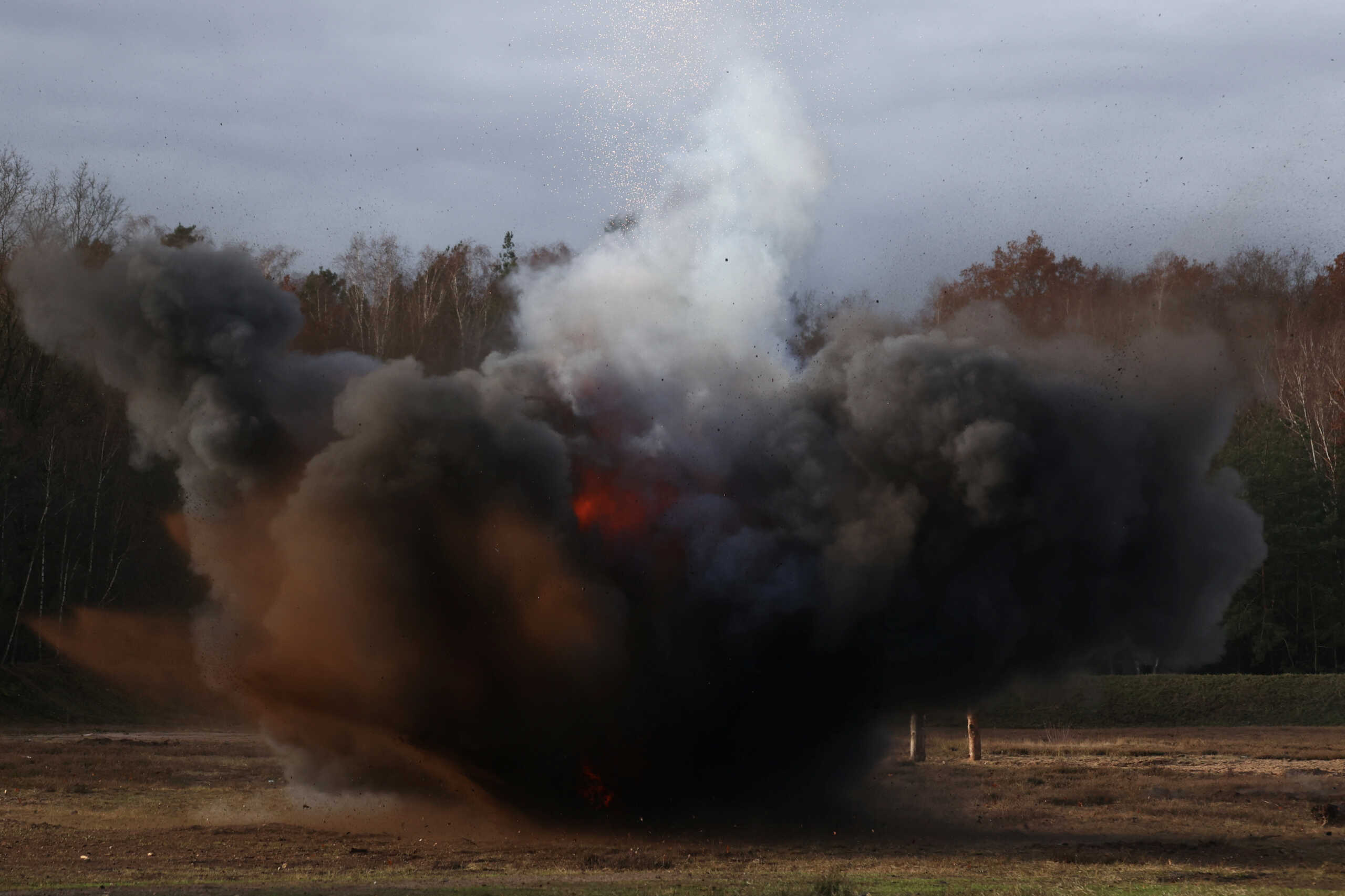 A mine explodes during mine sweeping training for Ukrainian soldiers at the multinational special training area of Germany's army Bundeswehr in Altengrabow near Magdeburg, Germany, December 12, 2023.  REUTERS