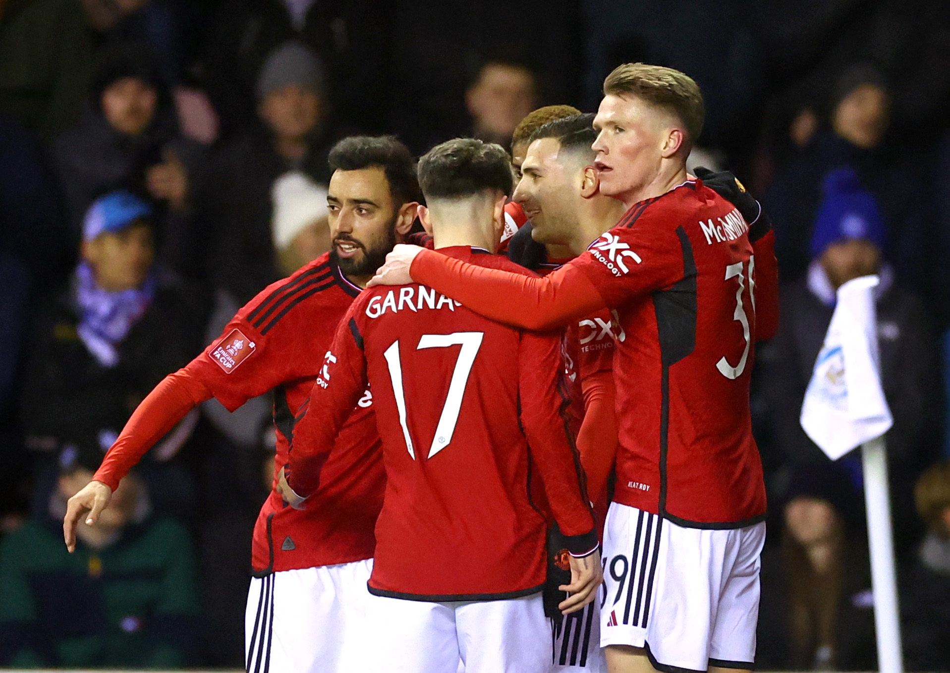 Soccer Football - FA Cup - Third Round - Wigan Athletic v Manchester United - DW Stadium, Wigan, Britain - January 8, 2024 Manchester United's Diogo Dalot celebrates scoring their first goal with teammates REUTERS
