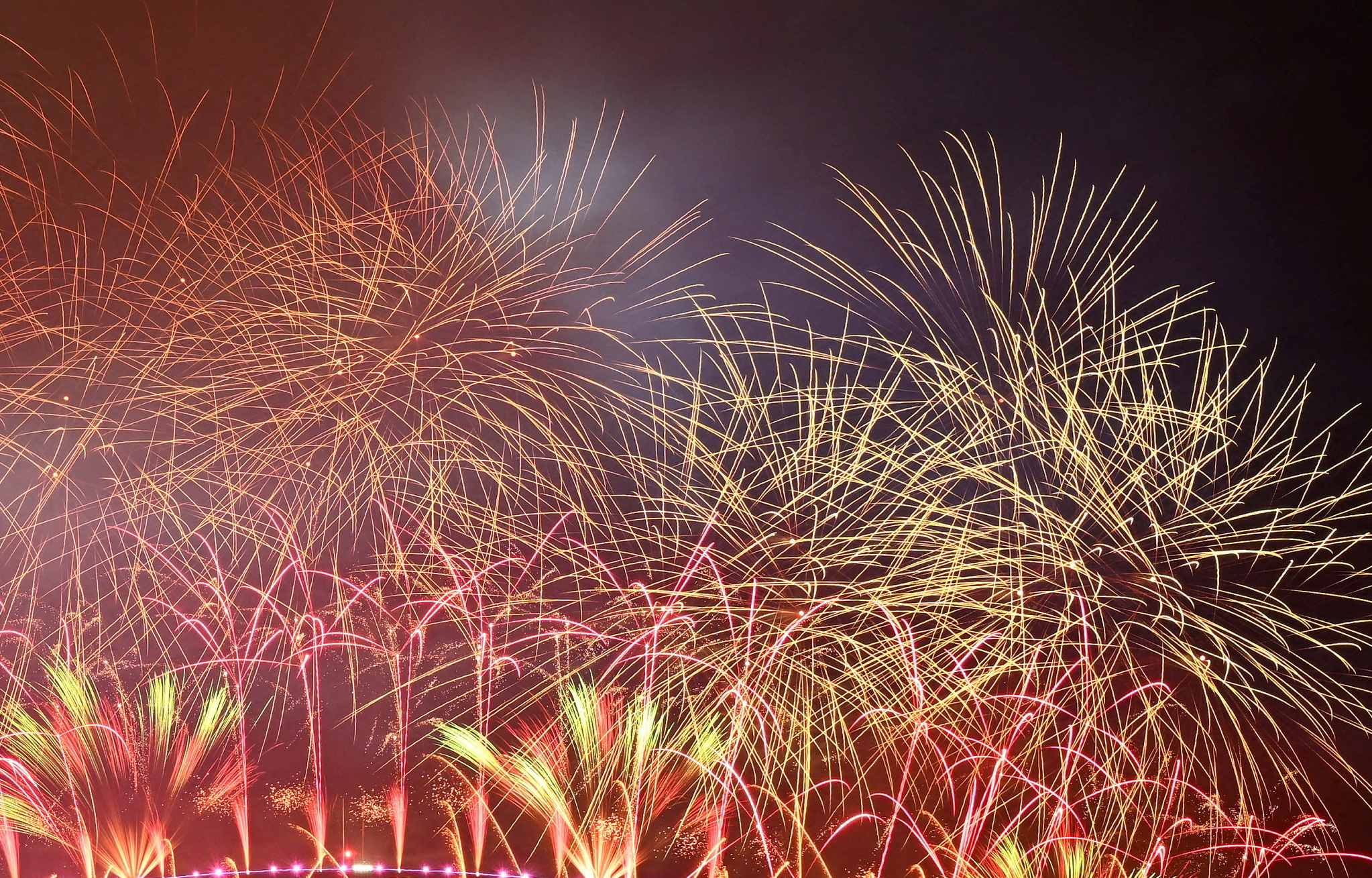 Fireworks are seen over the Sydney Opera House and Harbour Bridge during New Year's Eve celebrations in Sydney, Australia January 1, 2024. AAP Image