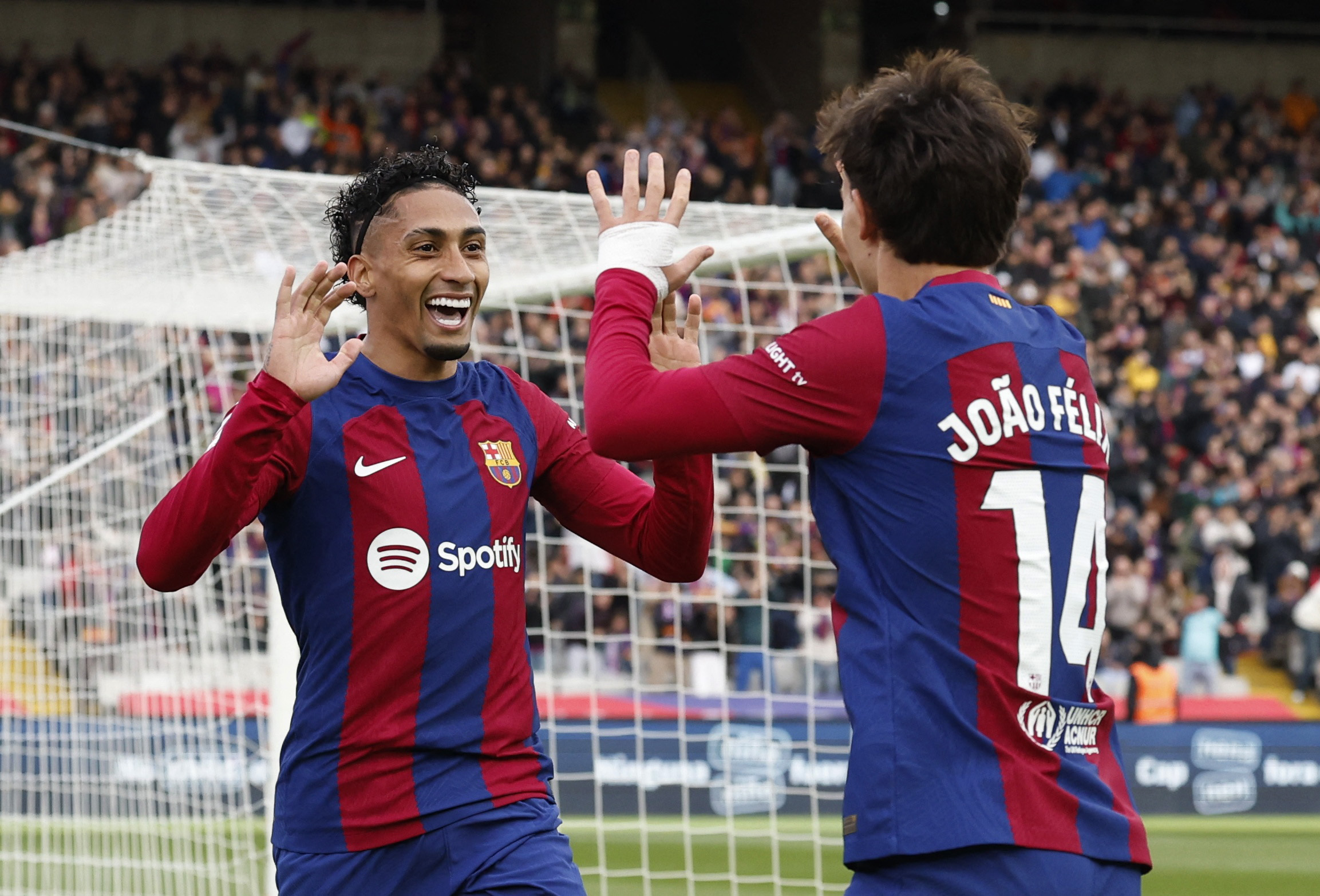 Soccer Football - LaLiga - FC Barcelona v Getafe - Estadi Olimpic Lluis Companys, Barcelona, Spain - February 24, 2024 FC Barcelona's Raphinha celebrates scoring their first goal with Joao Felix REUTERS