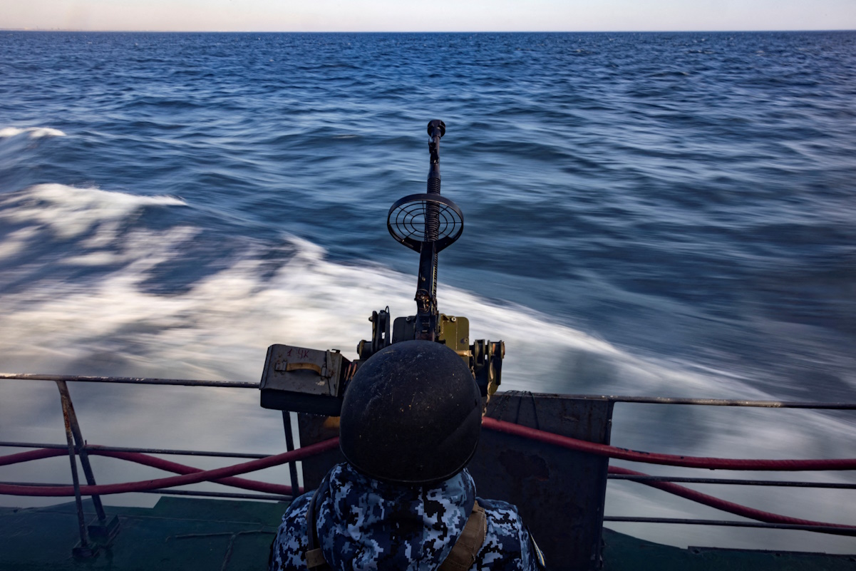 A serviceman of Ukraine’s coast guard mans a gun on a patrol boat in the Black Sea, amid Russia’s attack on Ukraine, February 7, 2024. REUTERS