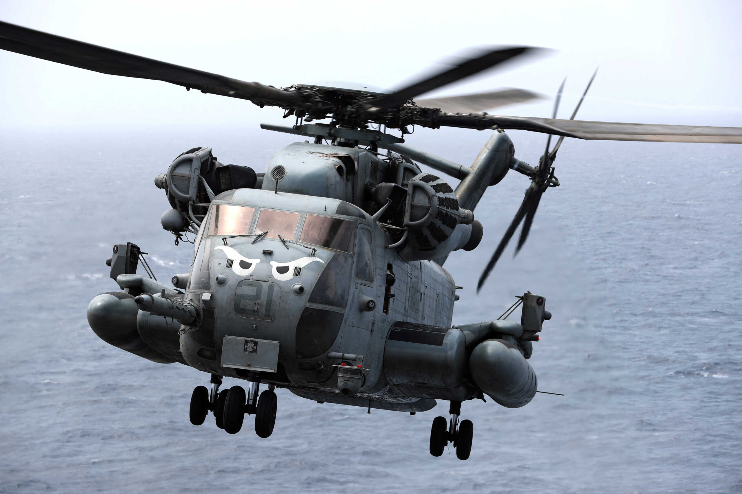 FILE PHOTO: CH-53E Super Stallion aircraft flies as it secures the area around the of USS Boxer (LHD-4) in the Arabian Sea off Oman July 17, 2019. REUTERS