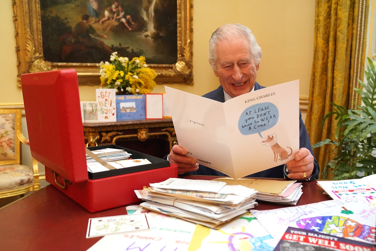 Britain's King Charles reads cards and messages, sent by well-wishers following his cancer diagnosis, in the 18th Century Room of the Belgian Suite in Buckingham Palace, London, Britain, February 21, 2024. Jonathan Brady