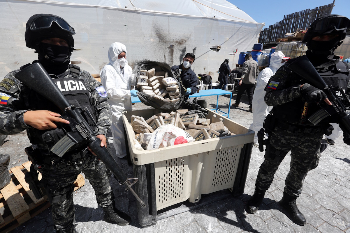 Ecuadorean authorities place drug packages in a container, as part of the more than 20 tons of seized drugs to be destroyed at an undisclosed location, in Ecuador January 25, 2024. Secretaria General de Comunicacion de la Presidencia del Ecuador (SEGCOM)