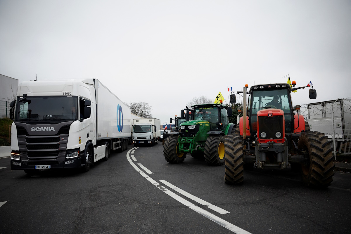 Tractors are parked in front of an international market during a protest over price pressures, taxes and green regulation, grievances shared by farmers across Europe, in Rungis, near Paris, France, January 31, 2024. REUTERS