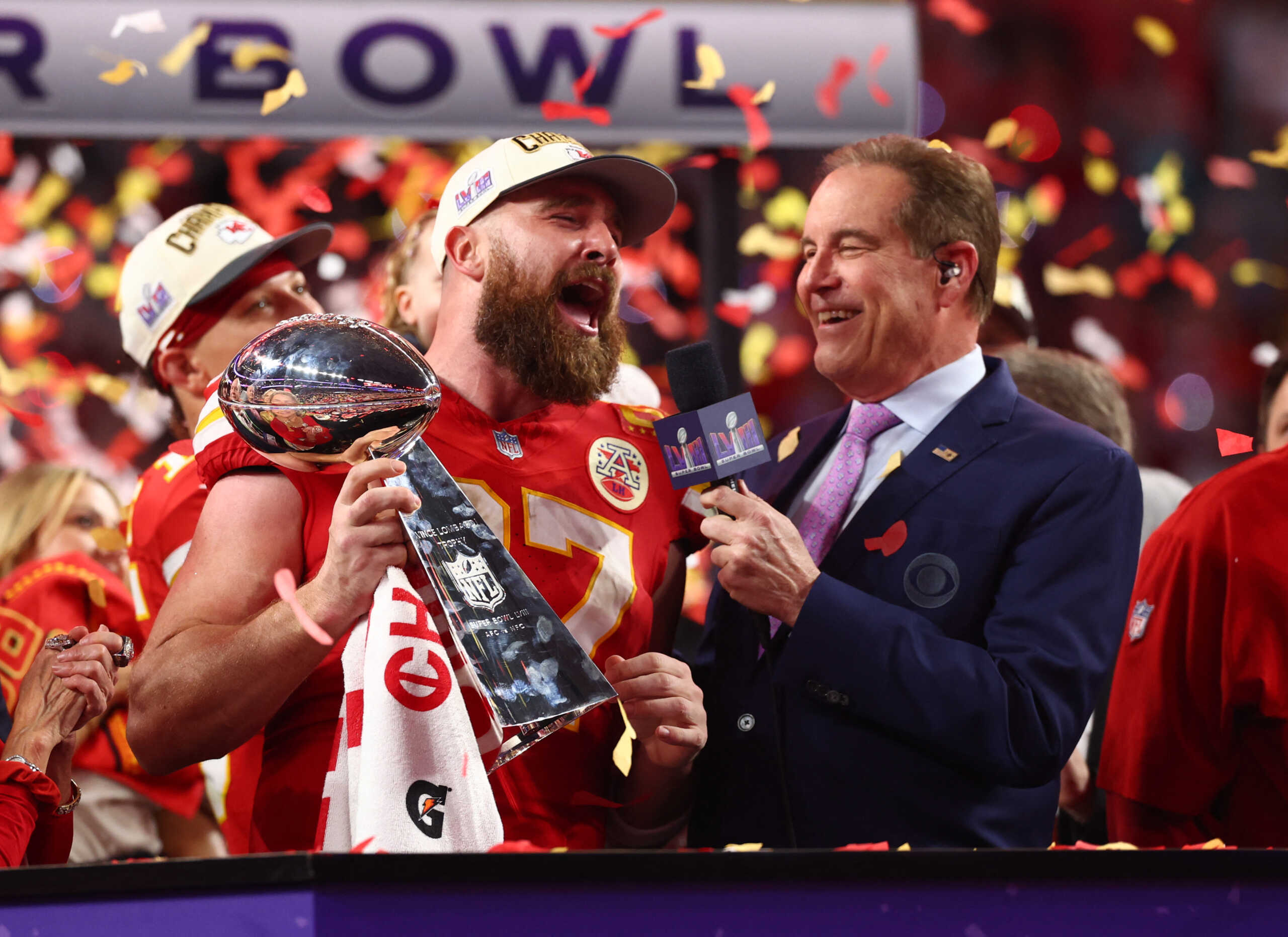 Feb 11, 2024; Paradise, Nevada, USA; Kansas City Chiefs tight end Travis Kelce (87) celebrates with the Vince Lombardi Trophy after defeating the San Francisco 49ers in Super Bowl LVIII at Allegiant Stadium. Mandatory Credit: Mark J. Rebilas-USA TODAY Sports