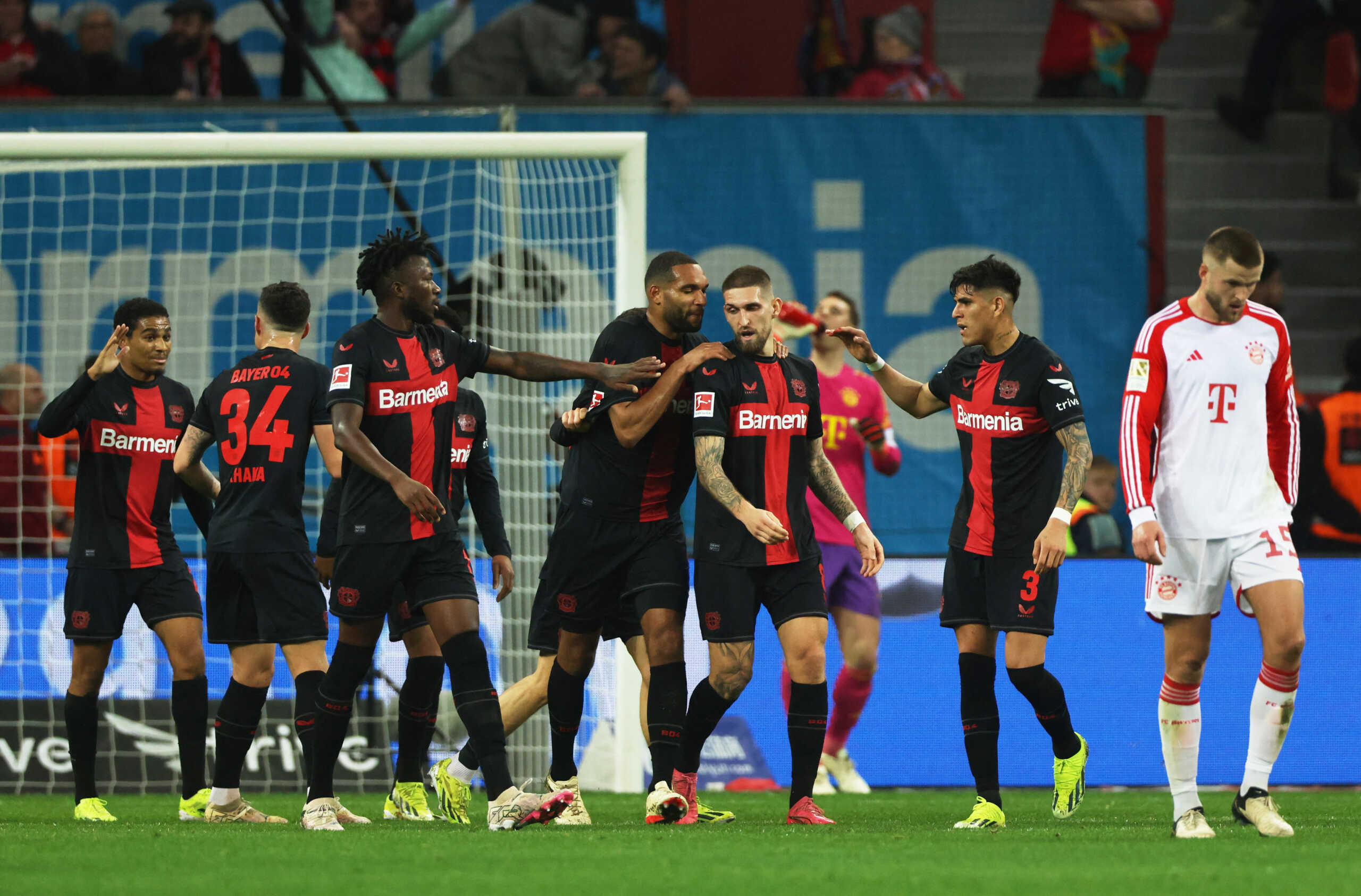 Soccer Football - Bundesliga - Bayer Leverkusen v Bayern Munich - BayArena, Leverkusen, Germany - February 10, 2024 Bayer Leverkusen players celebrate after Josip Stanisic scores their first goal REUTERS