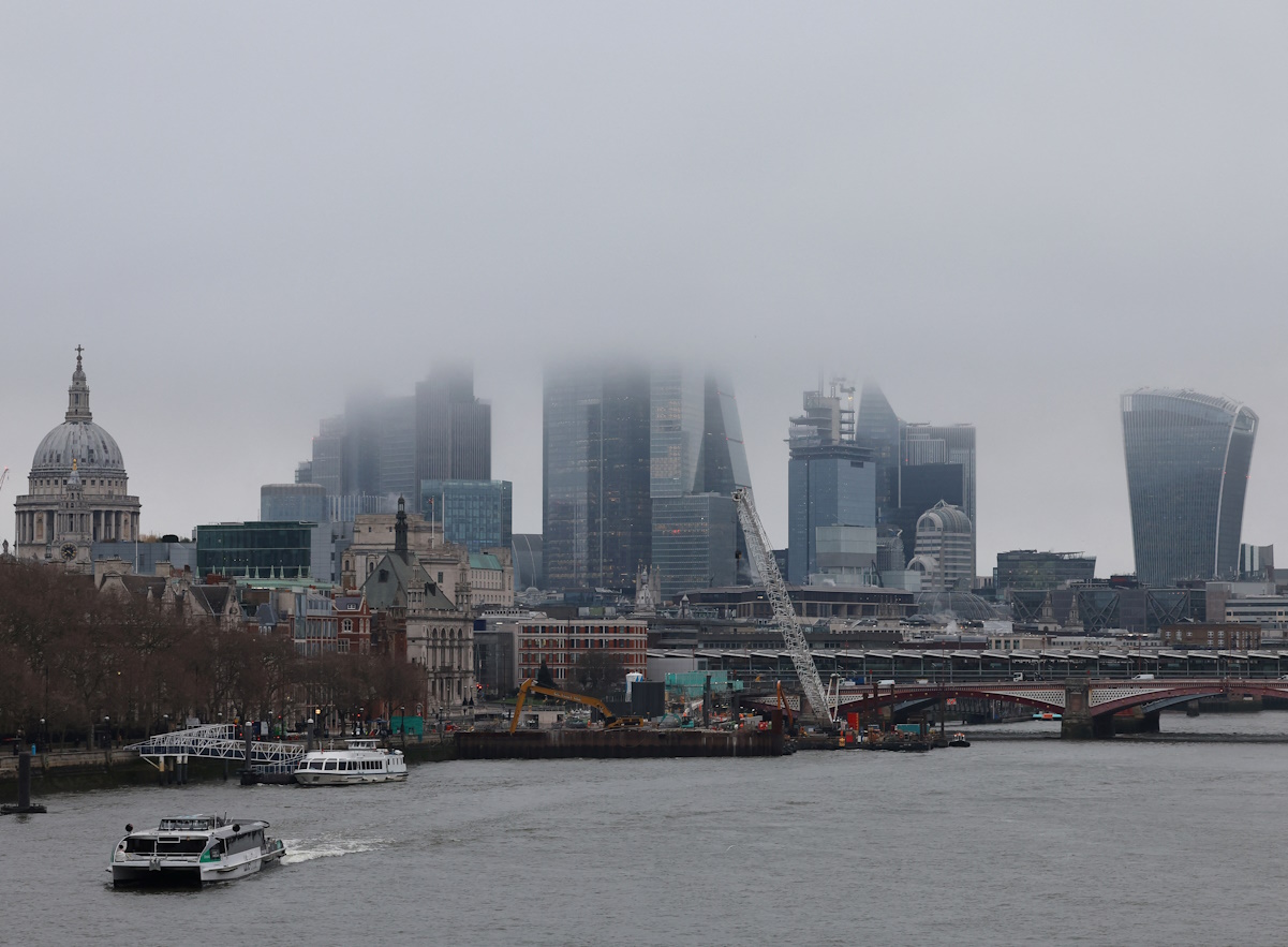 Low cloud and mist shroud the top of skyscrapers in the City of London financial district, Britain, February 2, 2024. REUTERS