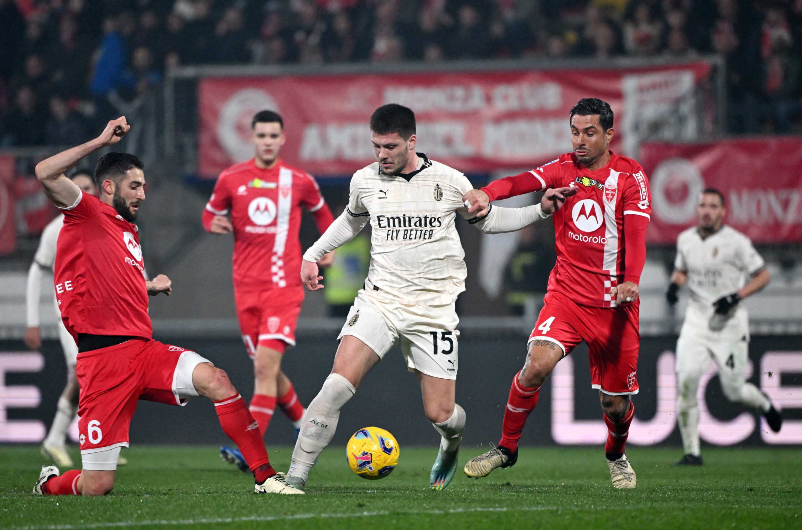 Soccer Football - Serie A - Monza v AC Milan - Stadio Brianteo, Monza, Italy - February 18, 2024 AC Milan's Luka Jovic in action with Monza's Roberto Gagliardini and Armando Izzo REUTERS
