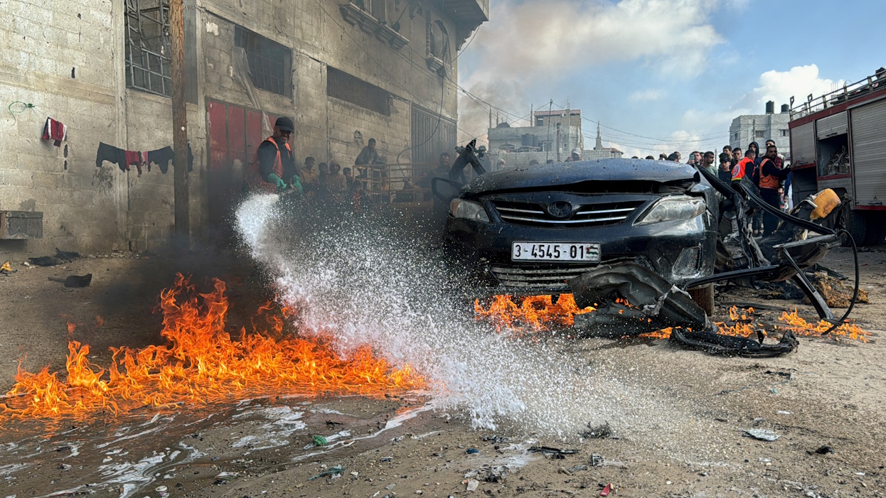 A firefighter extinguishes a burning car hit by an Israeli strike, amid the ongoing conflict between Israel and Palestinian Islamist group Hamas, in Rafah in the southern Gaza Strip, February 10, 2024. REUTERS