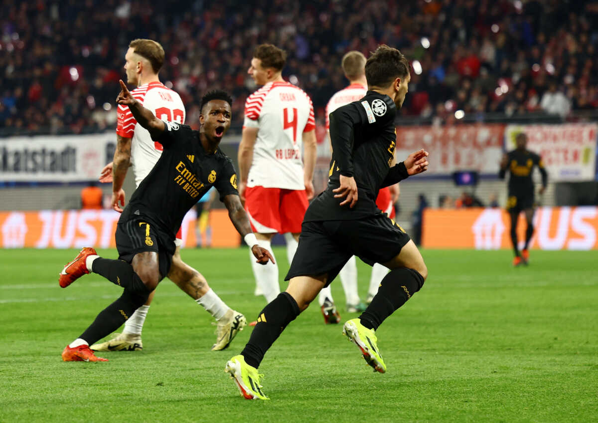 Soccer Football - Champions League - Round of 16 - First Leg - RB Leipzig v Real Madrid - Red Bull Arena, Leipzig, Germany - February 13, 2024 Real Madrid's Brahim Diaz celebrates scoring their first goal with Real Madrid's Vinicius Junior REUTERS