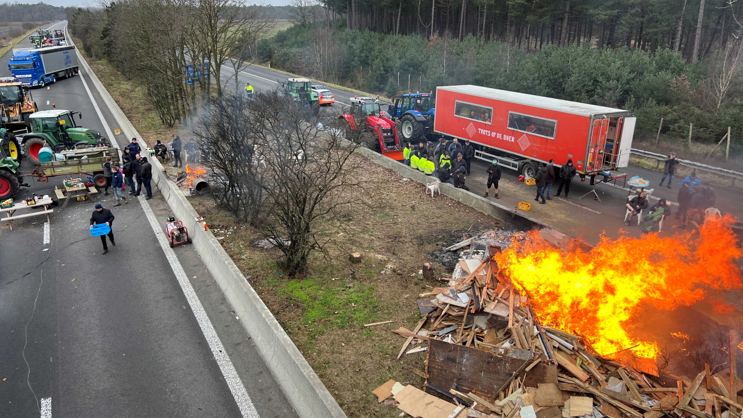 FILE PHOTO: Farmers use their tractors to block a highway near the border with the Netherlands as they protest over price pressures, taxes and green regulation, grievances shared by farmers across Europe, in Arendonk, Belgium February 2, 2024. REUTERS