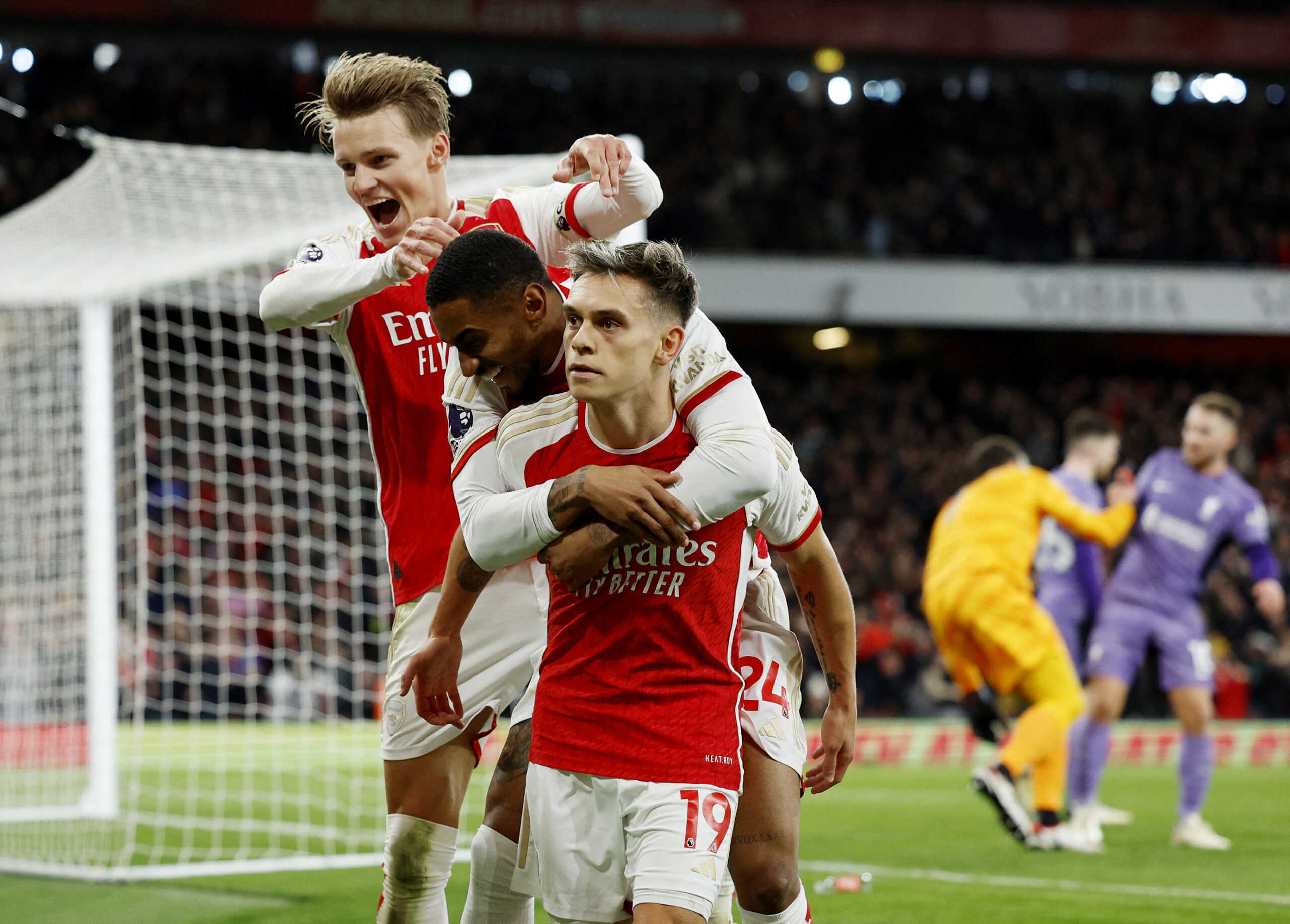 Soccer Football - Premier League - Arsenal v Liverpool - Emirates Stadium, London, Britain - February 4, 2024 Arsenal's Leandro Trossard celebrates scoring their third goal with Reiss Nelson and Martin Odegaard Action Images via Reuters