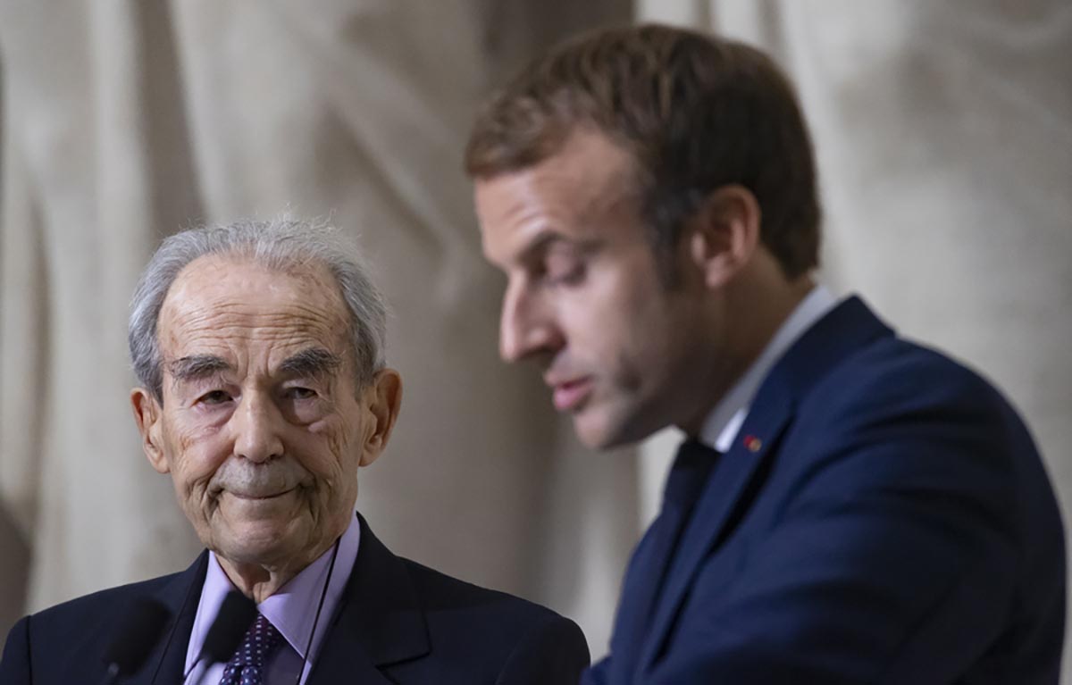 epa09514812 French President Emmanuel Macron (R) flanked by Former French Justice Minister Robert Badinter, author of of the abolitionist law in France (L)  delivers a speech during a ceremony marking the 40th anniversary of the abolition of the death penalty in France, at the Pantheon in Paris, France, 09 October 2021. In his speech, Macron announced his wish to launch an initiative for universal abolition of the death penalty.  EPA