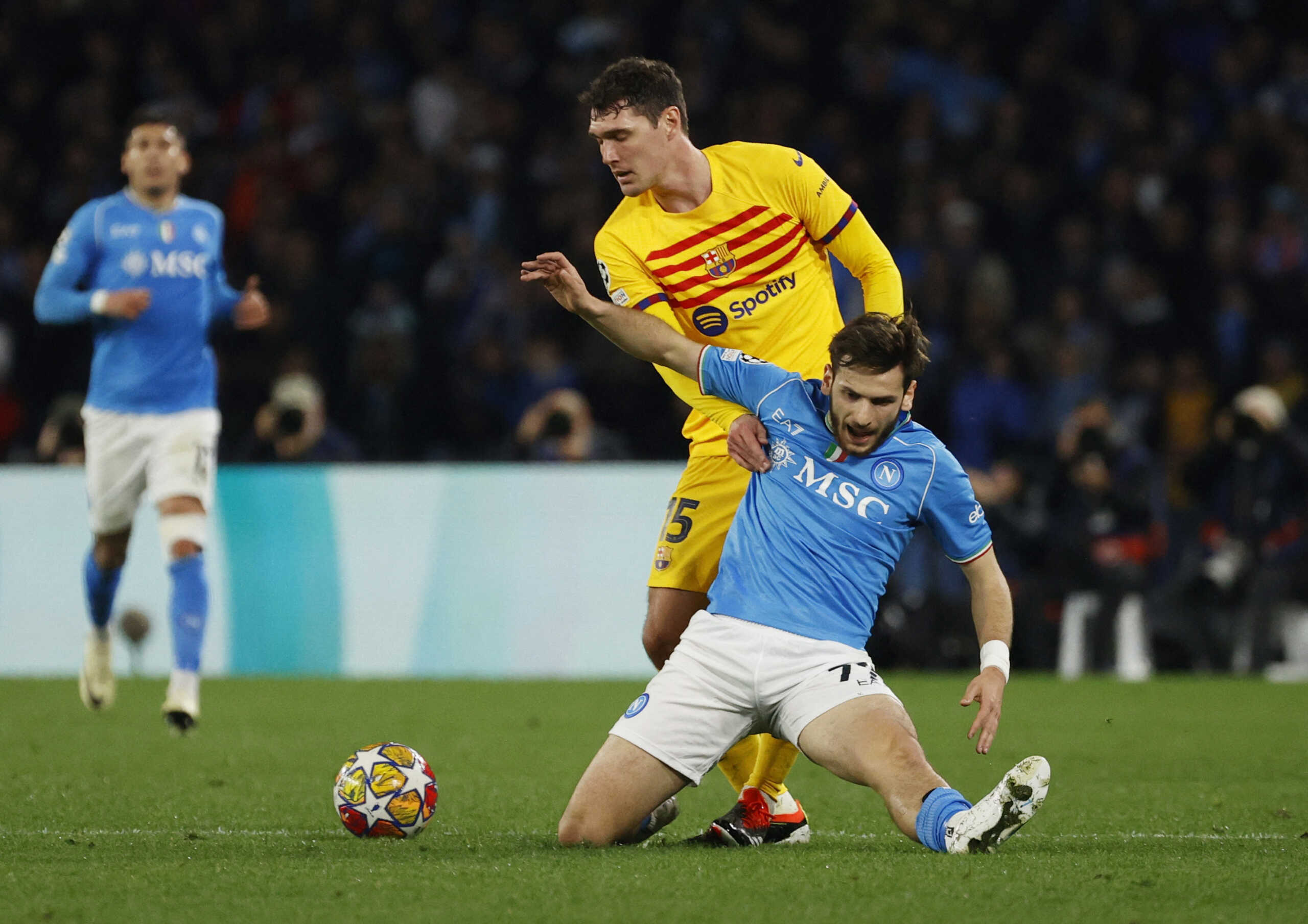 Soccer Football - Champions League - Round of 16 - First Leg - Napoli v FC Barcelona - Stadio Diego Armando Maradona, Naples, Italy - February 21, 2024 FC Barcelona's Andreas Christensen in action with Napoli's Khvicha Kvaratskhelia REUTERS