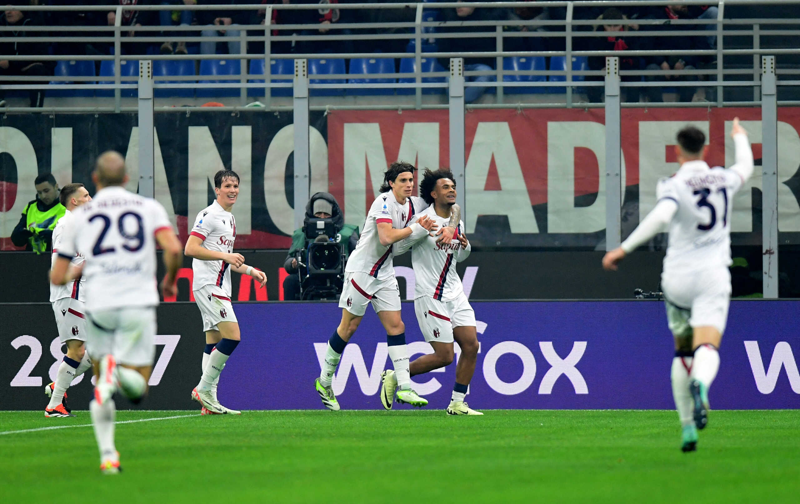 Soccer Football - Serie A - AC Milan v Bologna - San Siro, Milan, Italy - January 27, 2024 Bologna's Joshua Zirkzee celebrates scoring their first goal with teammates REUTERS