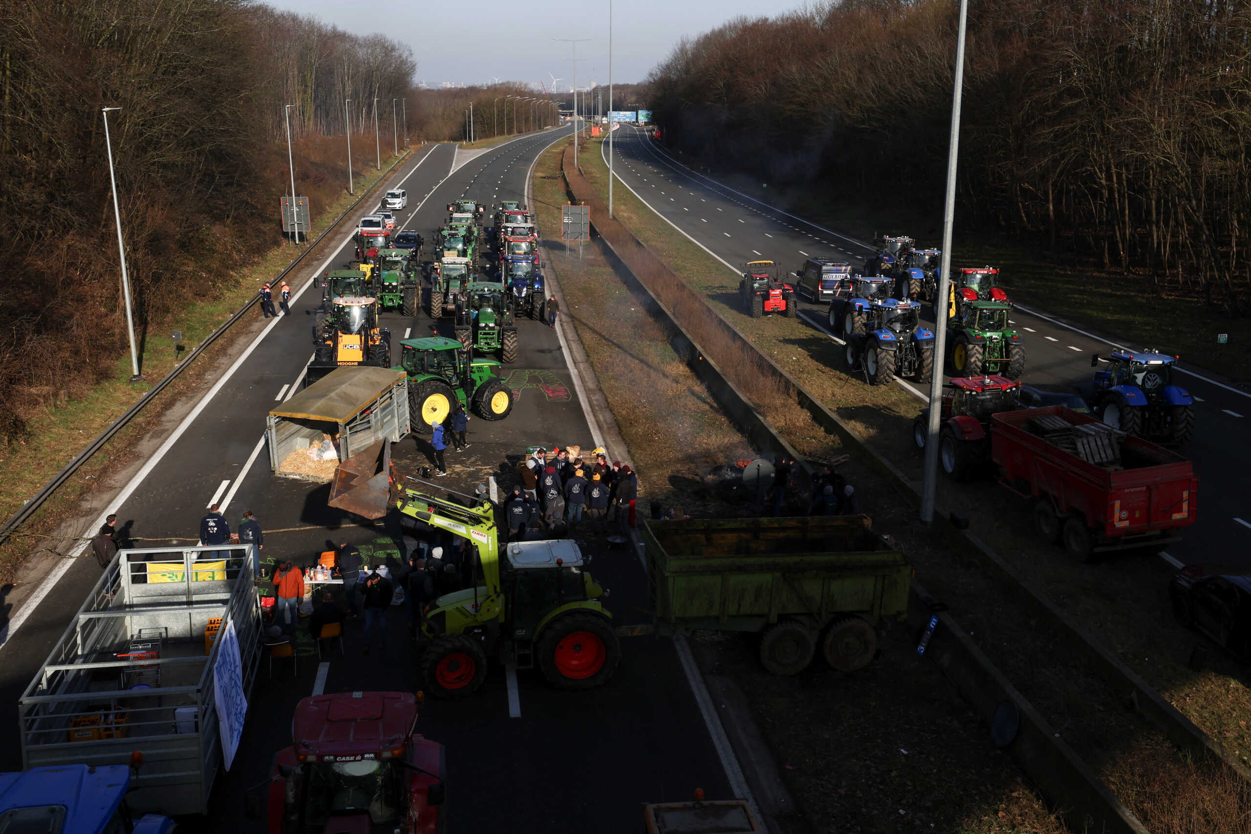 Belgian farmers use their tractors to block the Brussels ring as they protest over price pressures, taxes and green regulation, grievances shared by farmers across Europe, in Halle, Belgium January 29, 2024. REUTERS