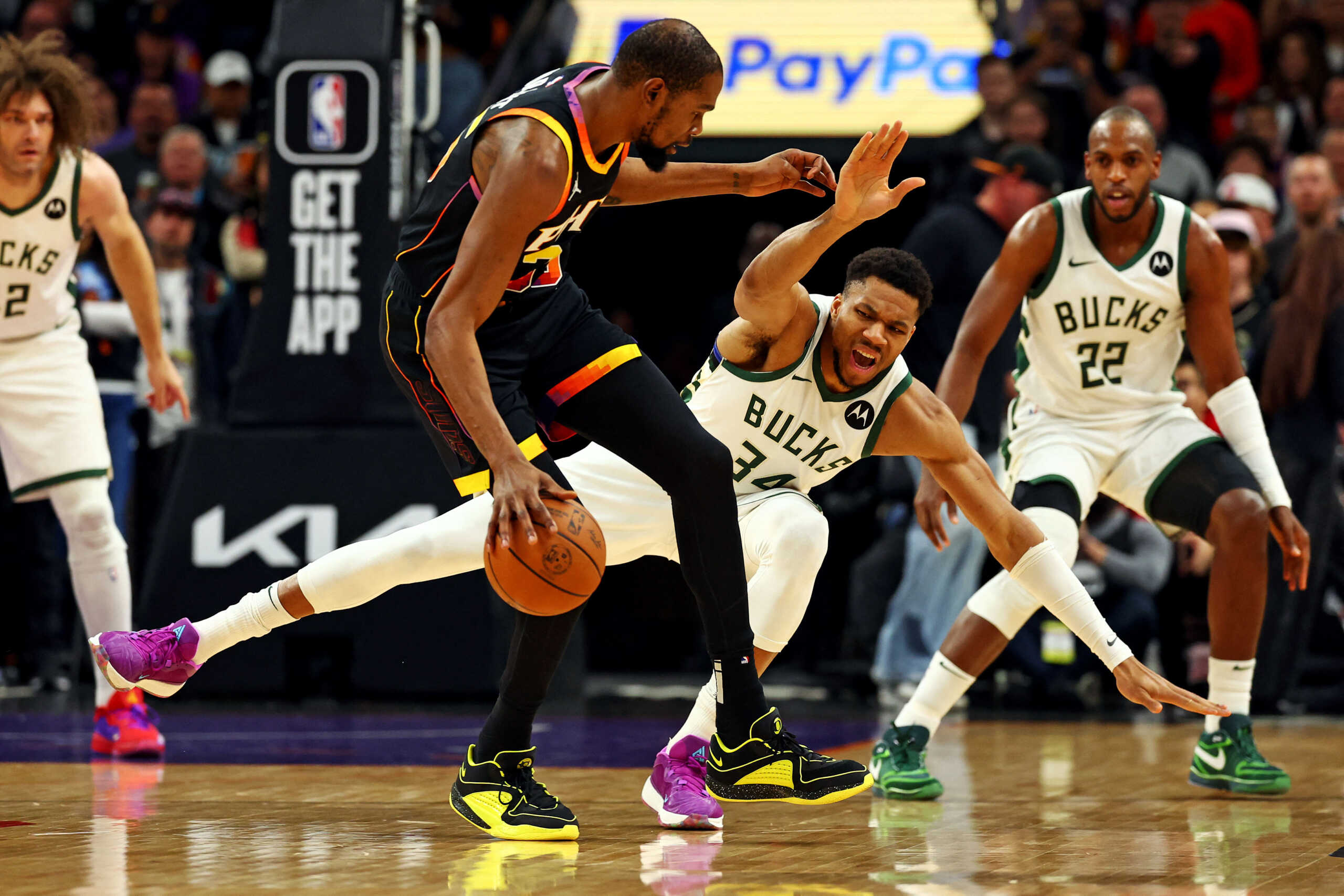Feb 6, 2024; Phoenix, Arizona, USA; Phoenix Suns forward Kevin Durant (35) handles the ball against Milwaukee Bucks forward Giannis Antetokounmpo (34) during the first quarter at Footprint Center. Mandatory Credit: Mark J. Rebilas-USA TODAY Sports