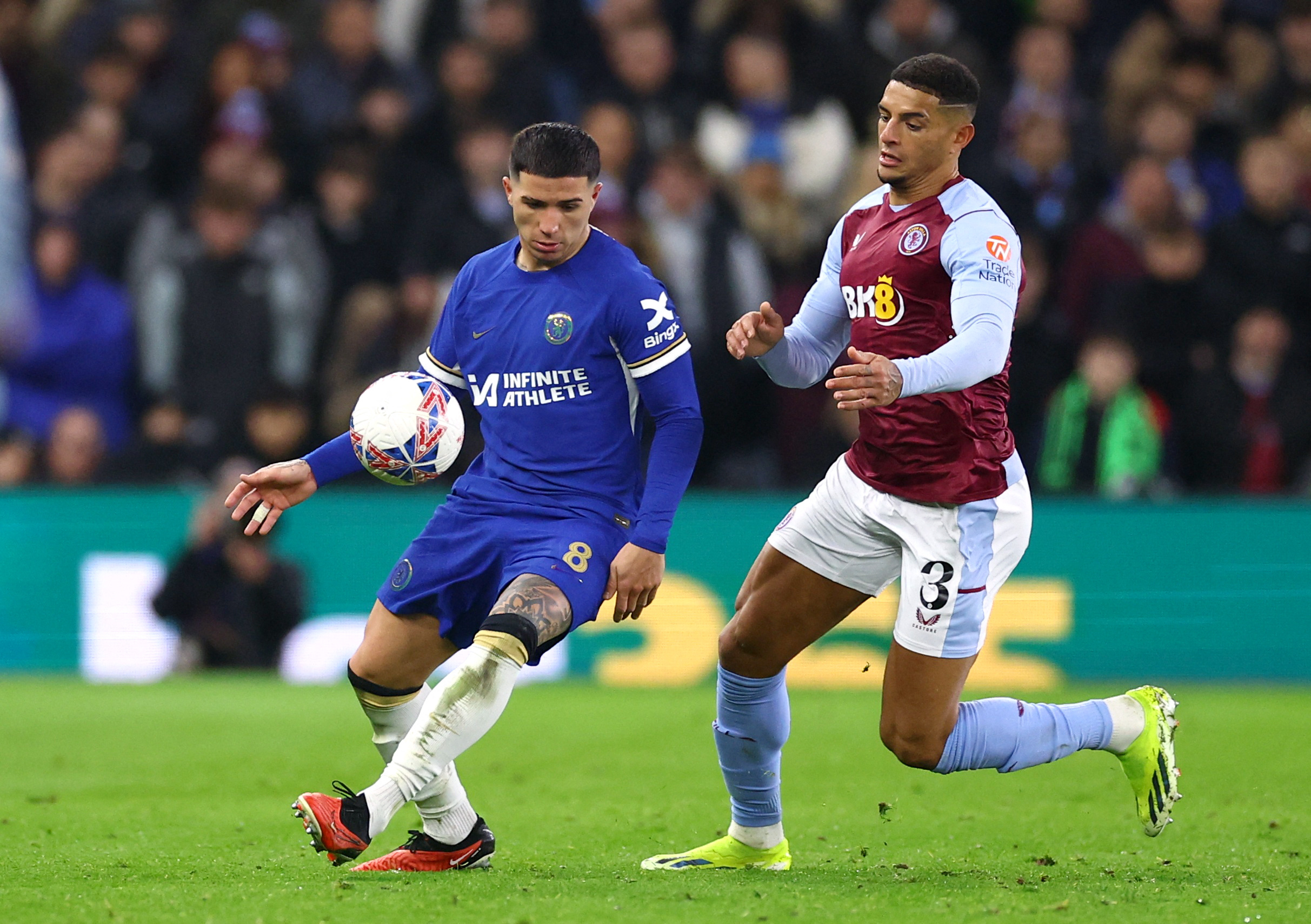 Soccer Football -  FA Cup - Fourth Round Replay - Aston Villa v Chelsea - Villa Park, Birmingham, Britain - February 7, 2024 Chelsea's Enzo Fernandez in action with Aston Villa's Diego Carlos REUTERS