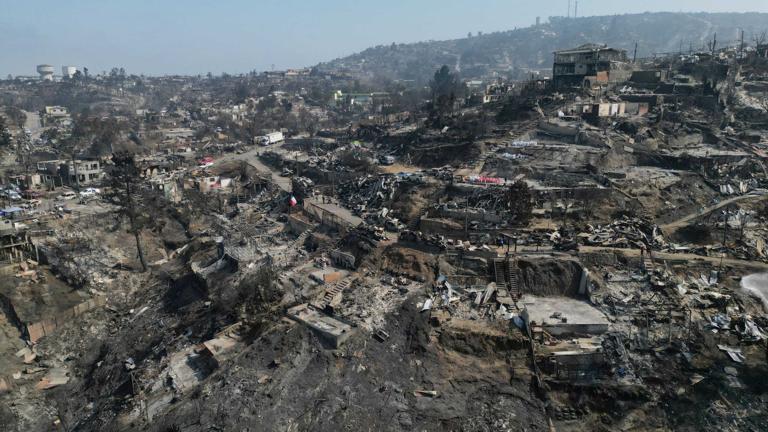 Remains of houses burned are seen following the spread of wildfires in Vina del Mar, Chile February 5, 2024. REUTERS