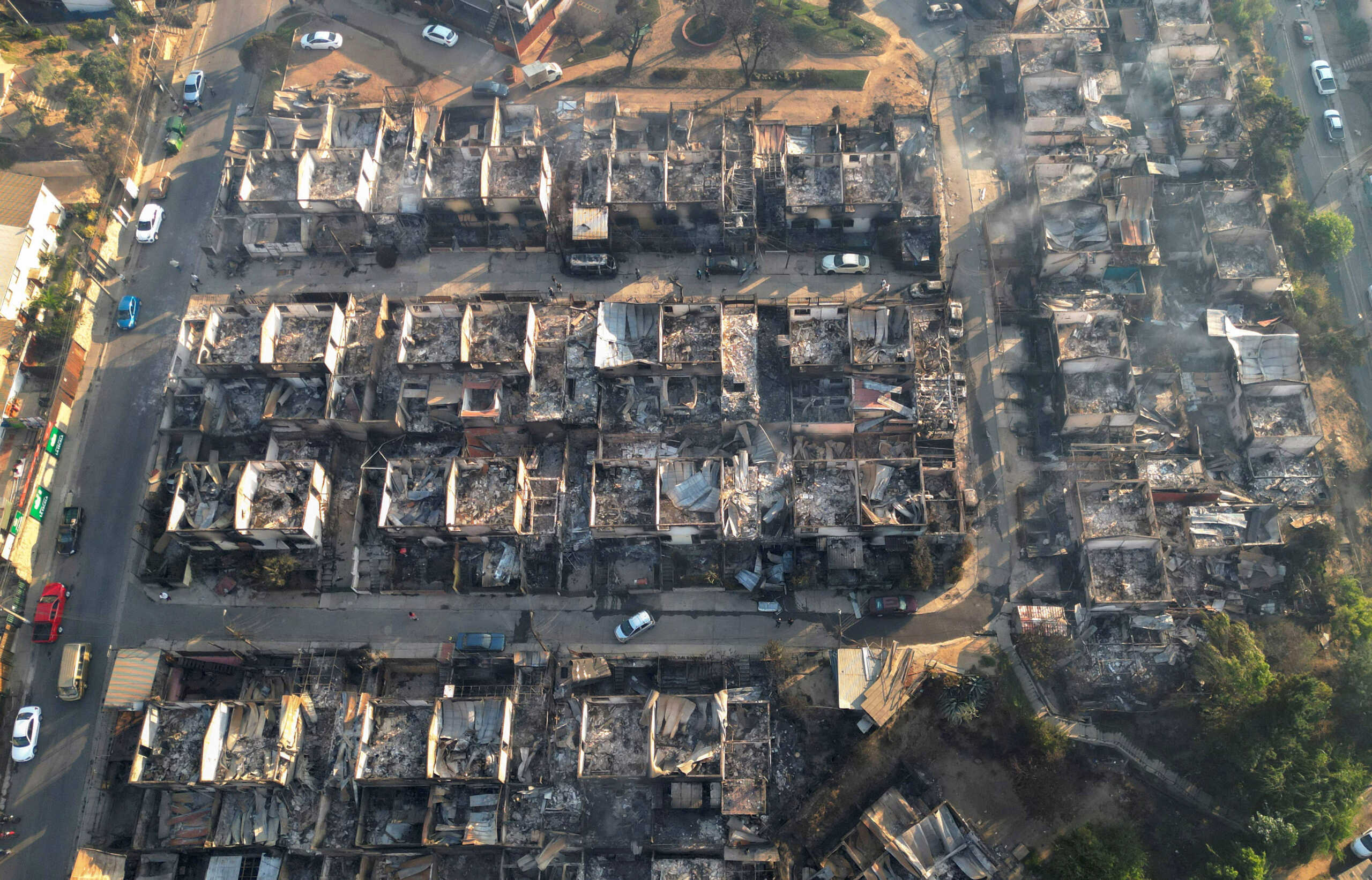 A view shows burned houses following the spread of wildfires in Vina del Mar, Chile February 3, 2024. REUTERS
