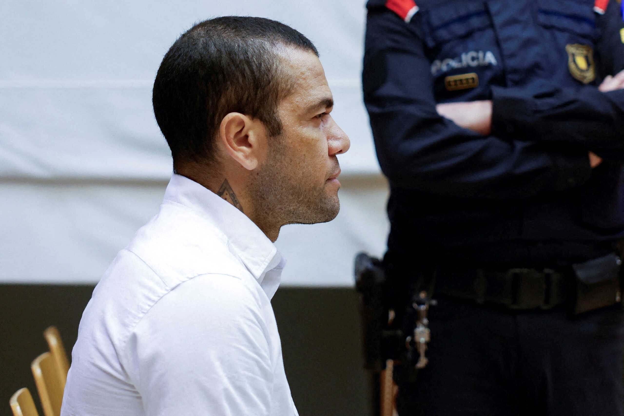 FILE PHOTO: Brazil soccer player Dani Alves sits in court during the first day of his trial in Barcelona, Spain, February 5, 2024. Alberto Estevez