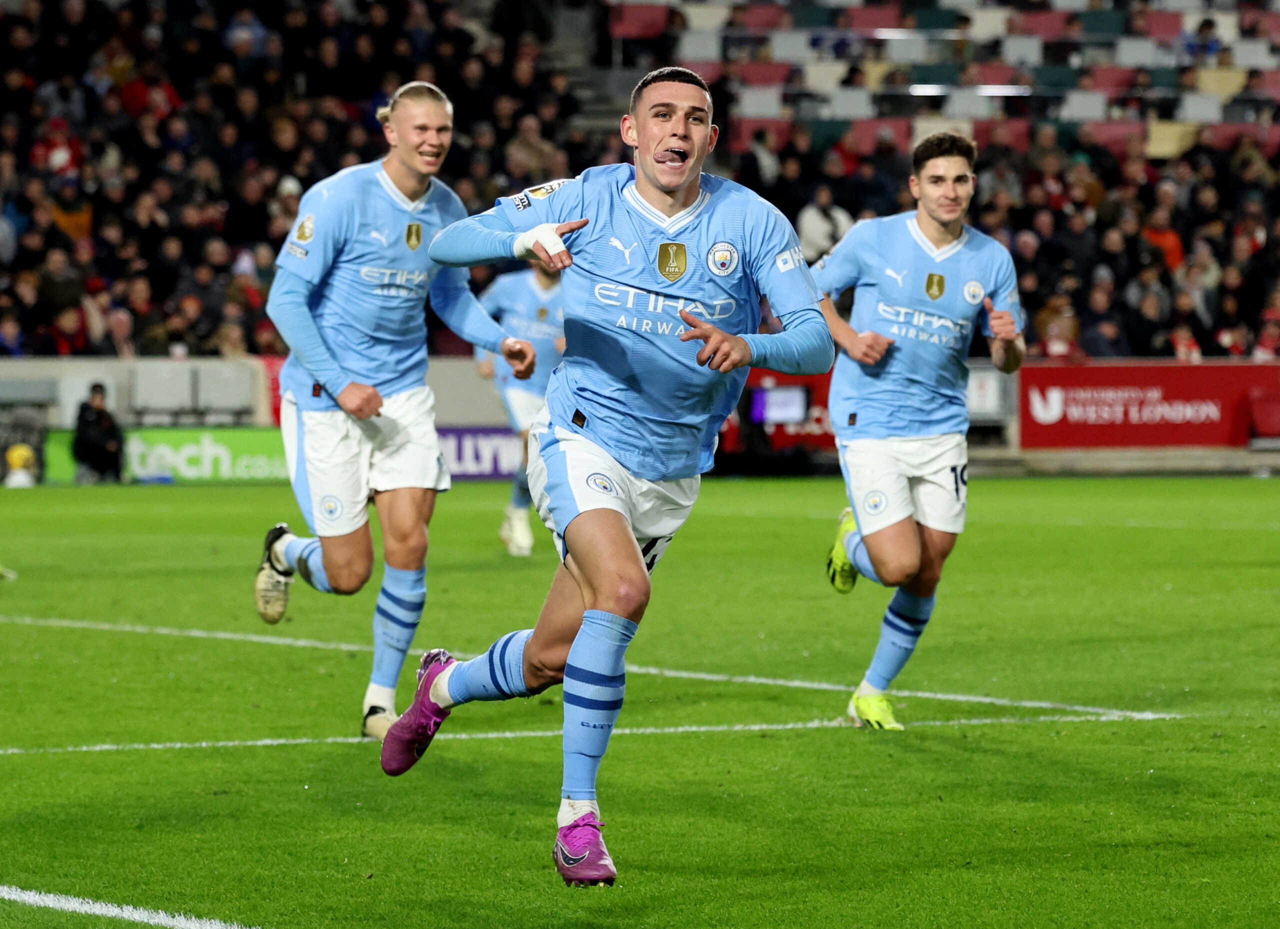 Soccer Football - Premier League - Brentford v Manchester City - Brentford Community Stadium, London, Britain - February 5, 2024 Manchester City's Phil Foden celebrates scoring their second goal with Erling Braut Haaland and Julian Alvarez REUTERS