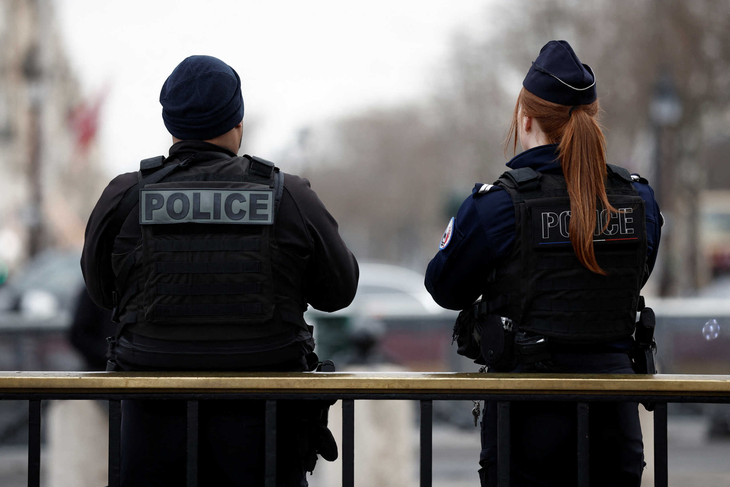 Paris police members patrol on the Champs Elysees avenue near the Arc de Triomphe in Paris, France, February 1, 2024. REUTERS